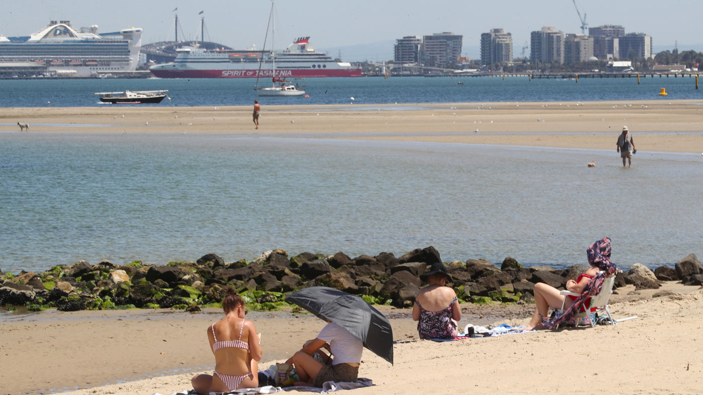 Beachgoers are seen at St Kilda beach in Melbourne, Thursday, January 30, 2020. The mercury is expected to reach 39C in Melbourne on Thursday before hitting a top of 43C on Friday afternoon
