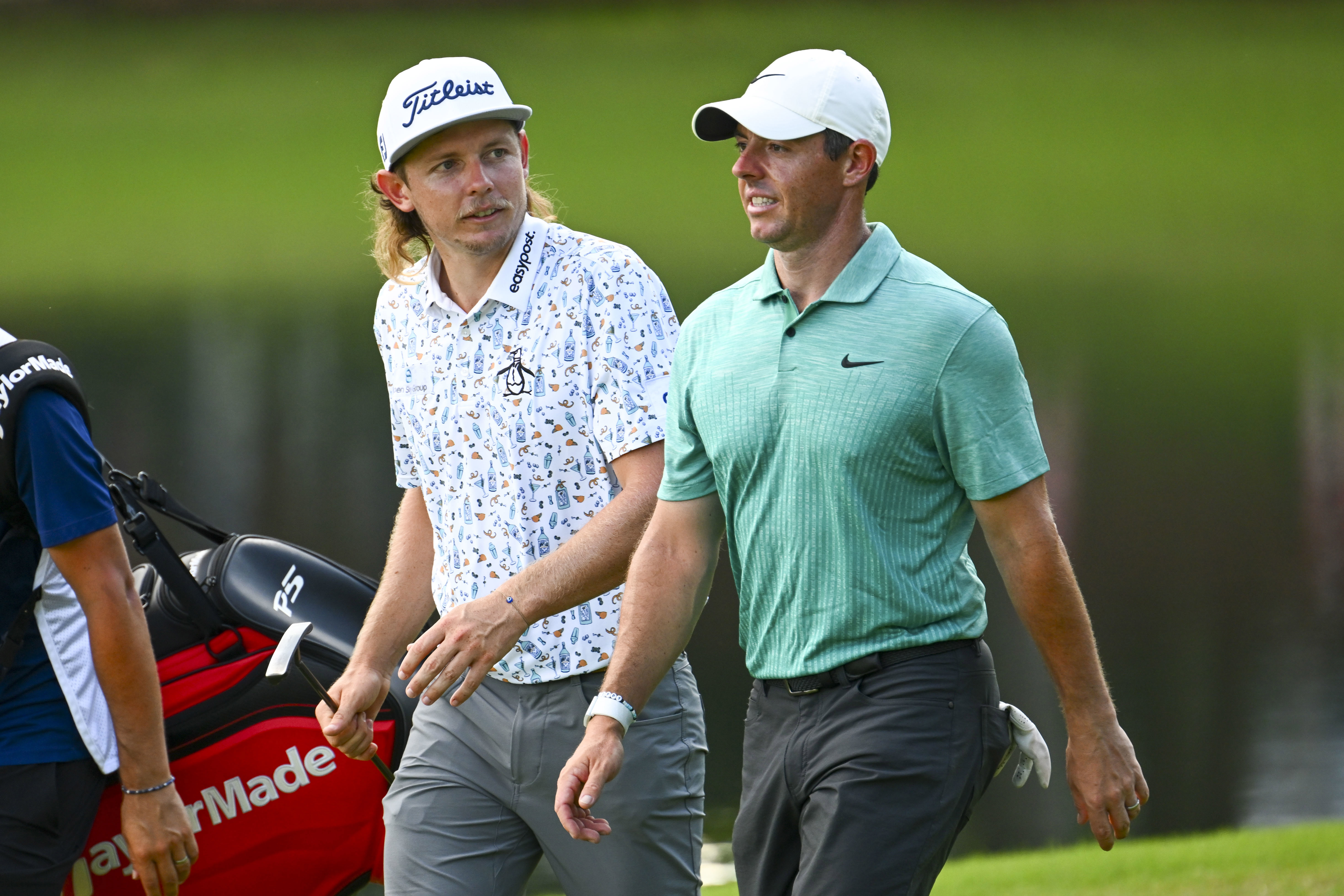 Cameron Smith of Australia and Rory McIlroy of Northern Ireland walk on the 18th hole during the second round of the TOUR Championship at East Lake Golf Club on August 26, 2022 in Atlanta, Georgia. (Photo by Chris Condon/PGA TOUR)