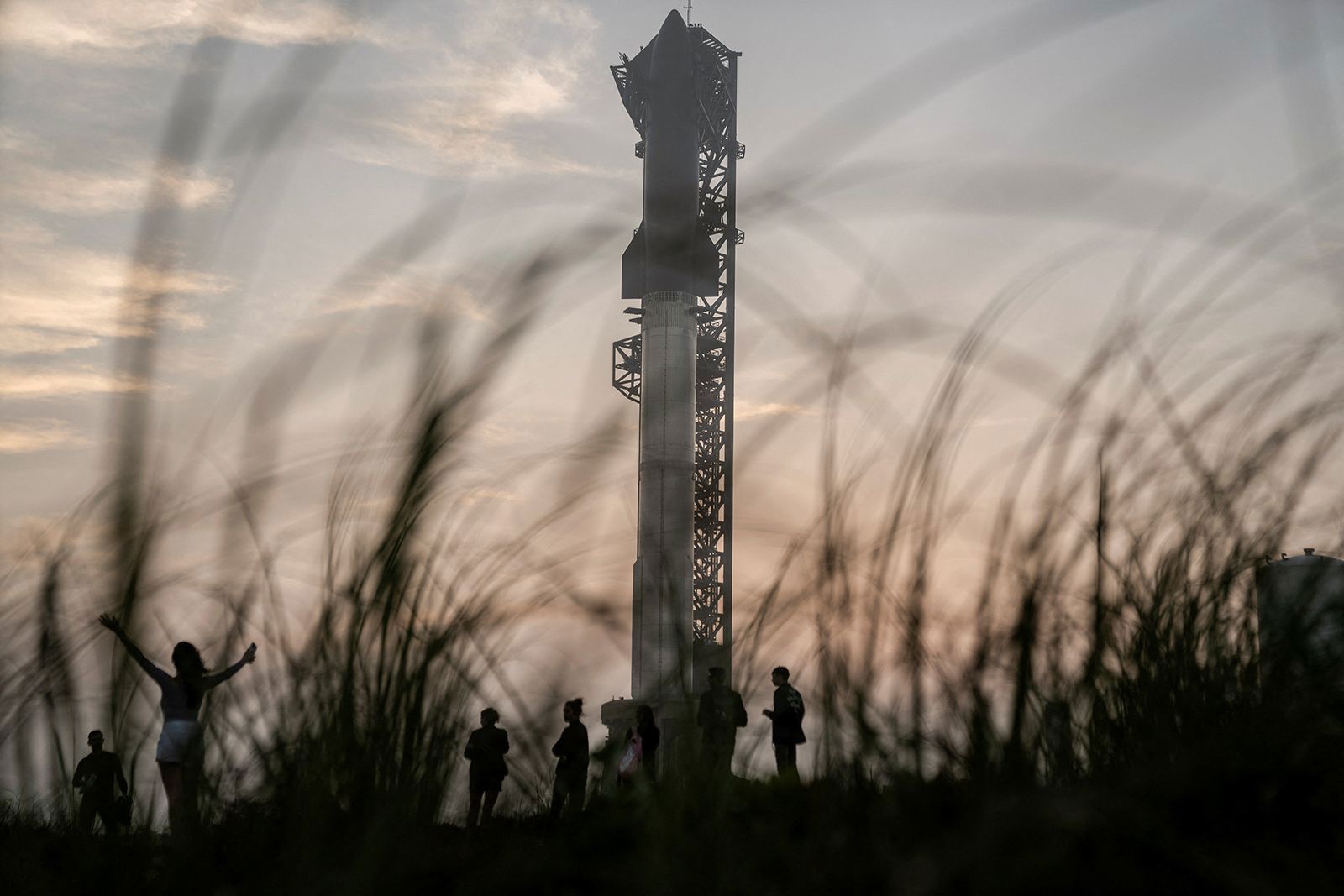 Spectators gather on March 13 as SpaceX's next-generation Starship spacecraft is prepared for a third launch from the company's Boca Chica launchpad on an uncrewed test flight, near Brownsville, Texas.