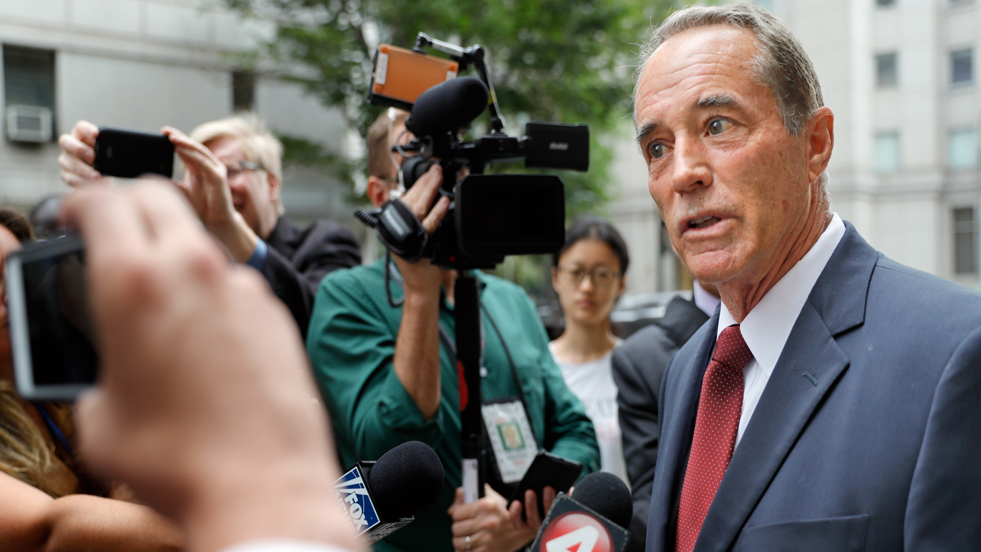 US Republican Congressman Chris Collins speaks to reporters as he leaves the courthouse after a pretrial hearing in his insider-trading case, in New York.