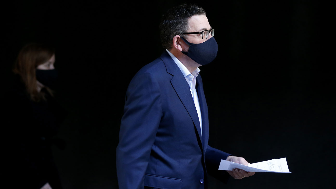 Daniel Andrews wearing a mask ahead of his press conference.