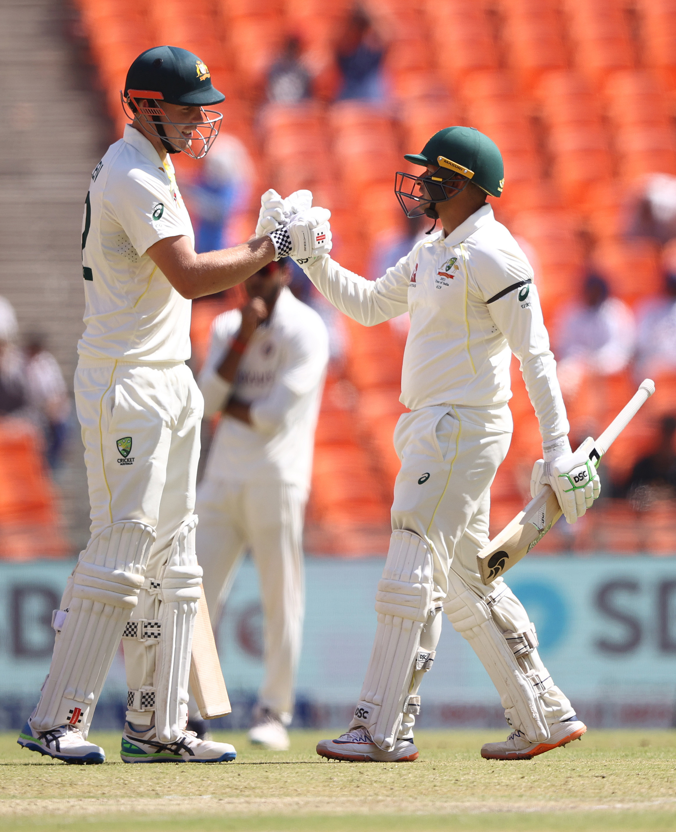 AHMEDABAD, INDIA - MARCH 10: Usman Khawaja of Australia is congratulated by Cameron Green after scoring 150 runs during day two of the Fourth Test match in the series between India and Australia at Narendra Modi Stadium on March 10, 2023 in Ahmedabad, India. (Photo by Robert Cianflone/Getty Images)