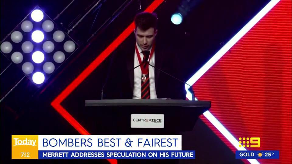 Bombers captain Zach Merrett accepts a sixth club medal.