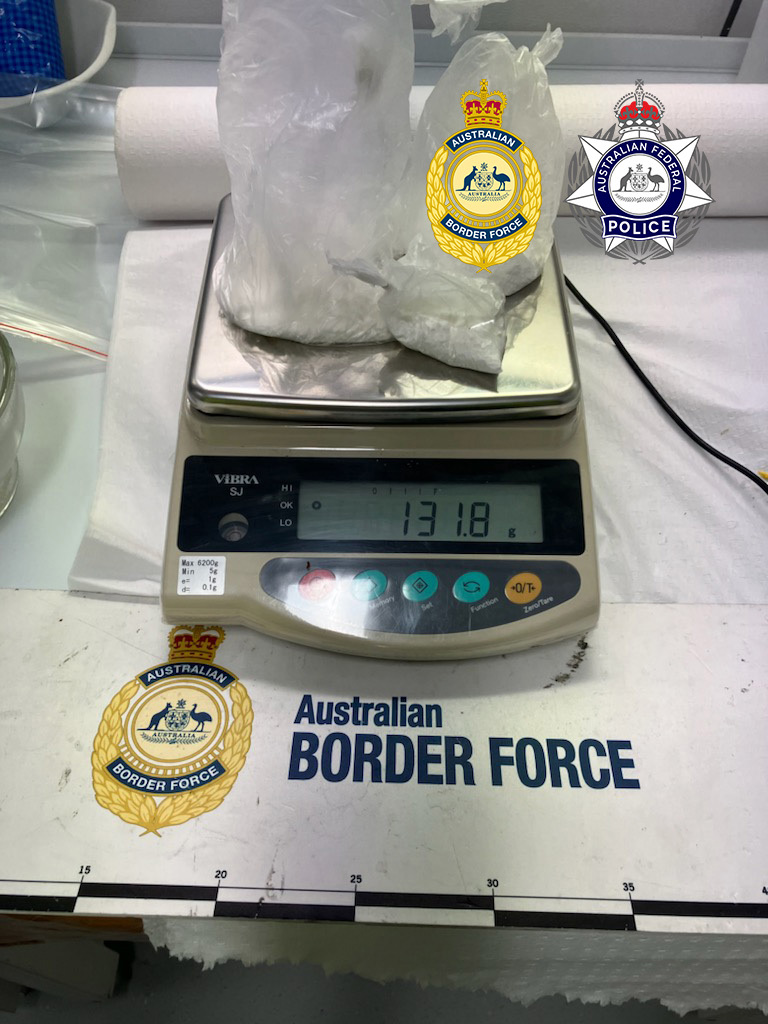 Two men have been sentenced after trying to smuggle 100 grams of cocaine into the Northern Territory, hidden inside sneakers.