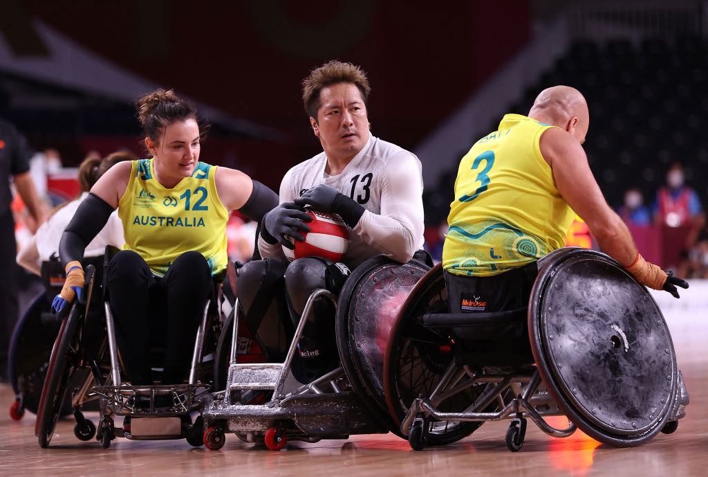 Shinichi Shimakawa #13 of Team Japan controls the ball against Shae Graham #12 and Ryley Batt #3 of Team Australia .