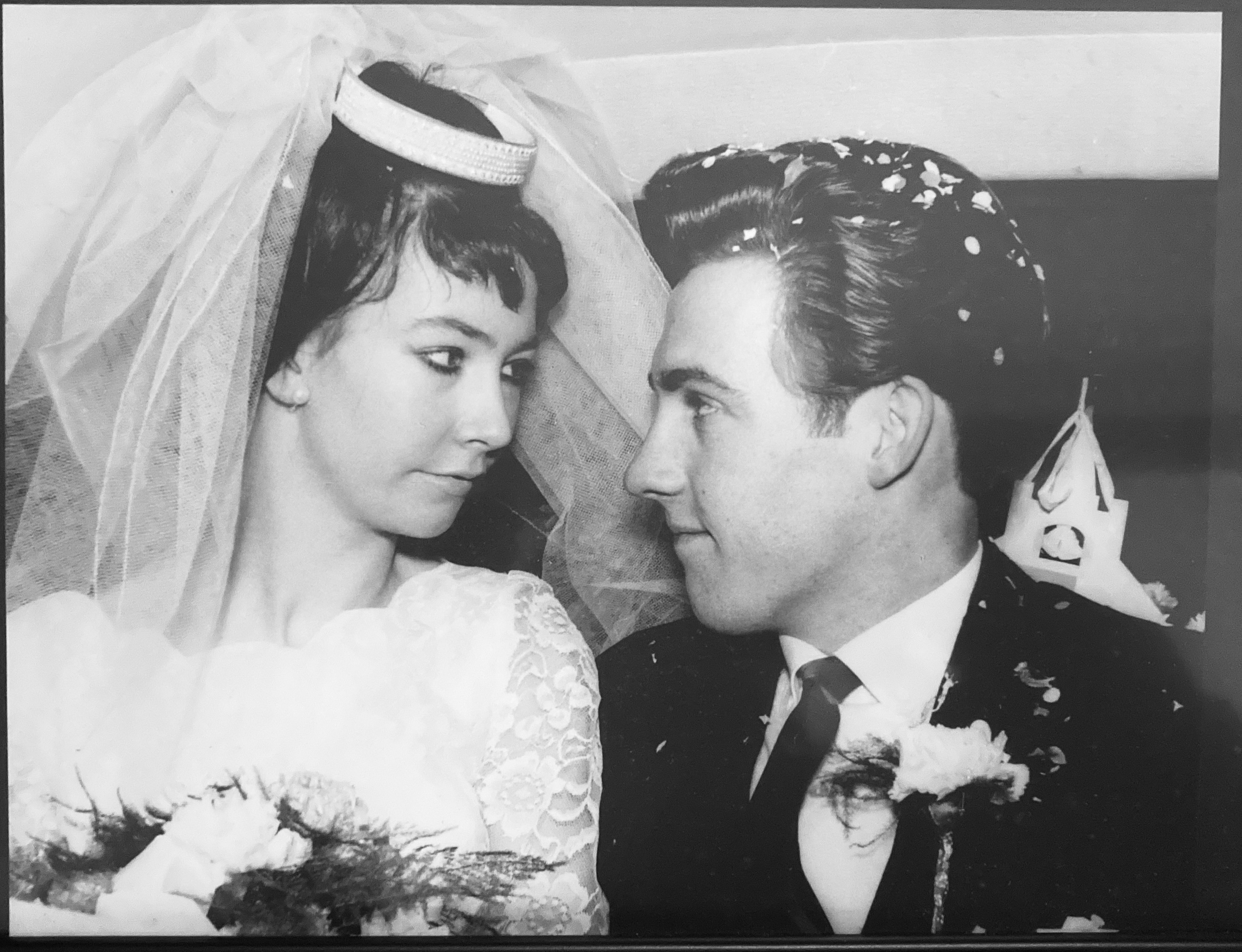 John and his wife on their wedding day.