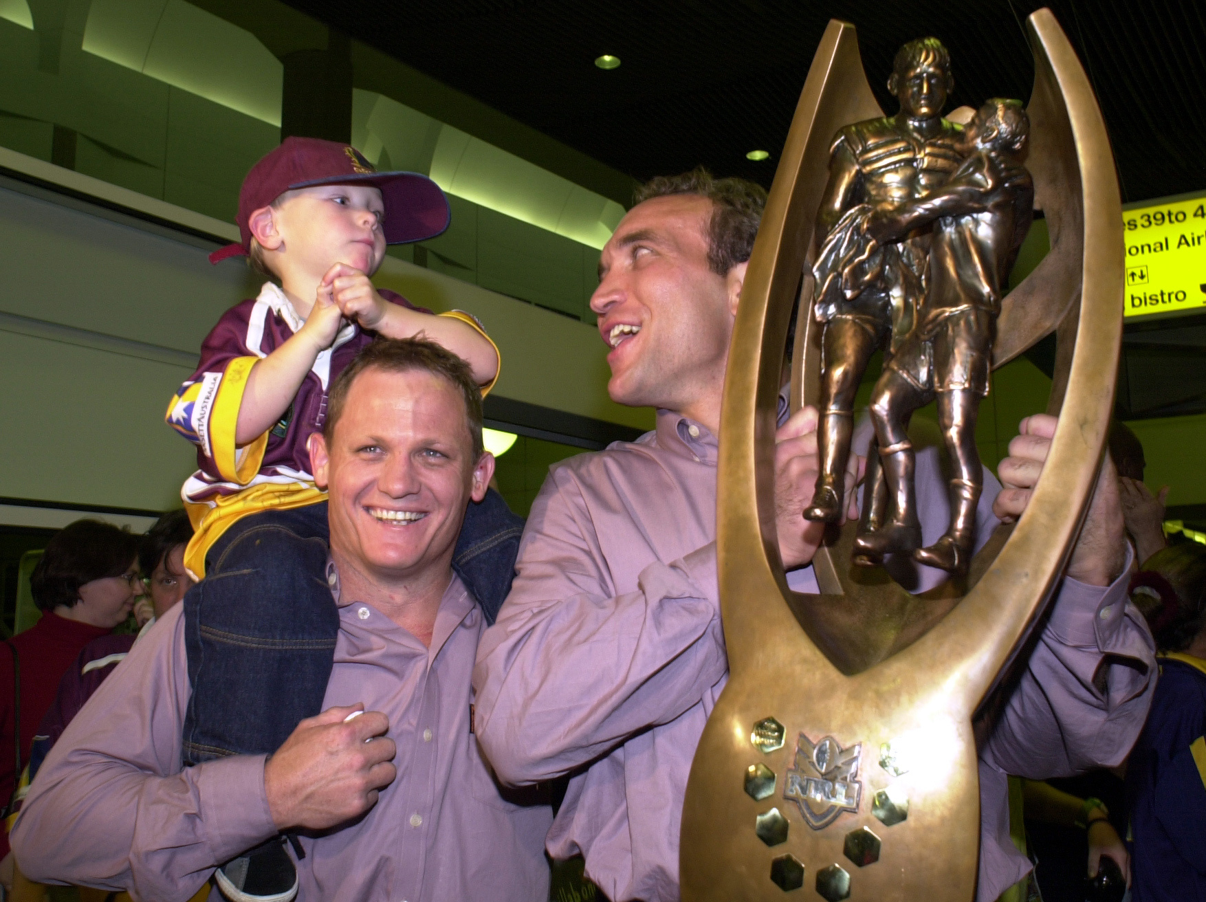 Kevin Walters and Gorden Tallis of the Brisbane Broncos celebrate winning the 2000 NRL grand final against the Sydney Roosters with Broncos fans at Brisbane Airport in Brisbane, Australia.  DIGITAL IMAGE.  Mandatory Credit: Darren England/ALLSPORT