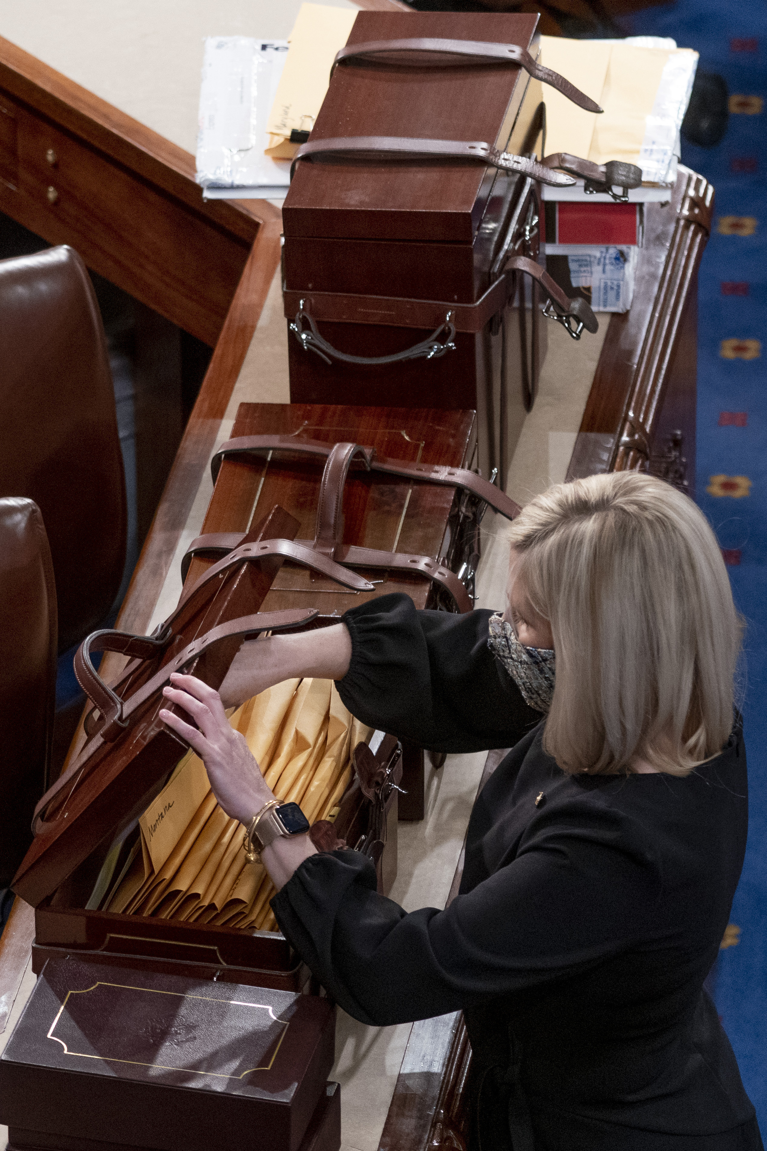 Boxes containing Electoral College votes are opened as a joint session of the House and Senate