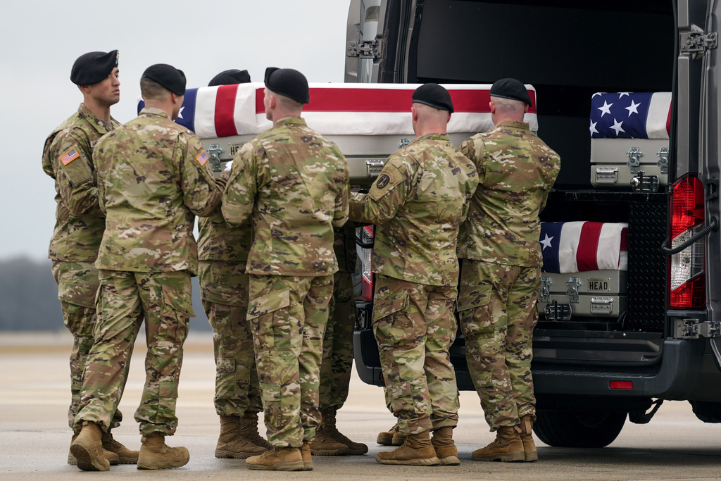 An Army carry team loads the transfer case containing the remains of U.S. Army Sgt. Kennedy Ladon Sanders, 24, of Waycross, Ga., to a vehicle along with the remains of Sgt. William Jerome Rivers, 46, of Carrollton, Ga., and Sgt. Breonna Alexsondria Moffett, 23, of Savannah, Ga., at Dover Air Force Base, Del., Friday, Feb. 2, 2024. 
