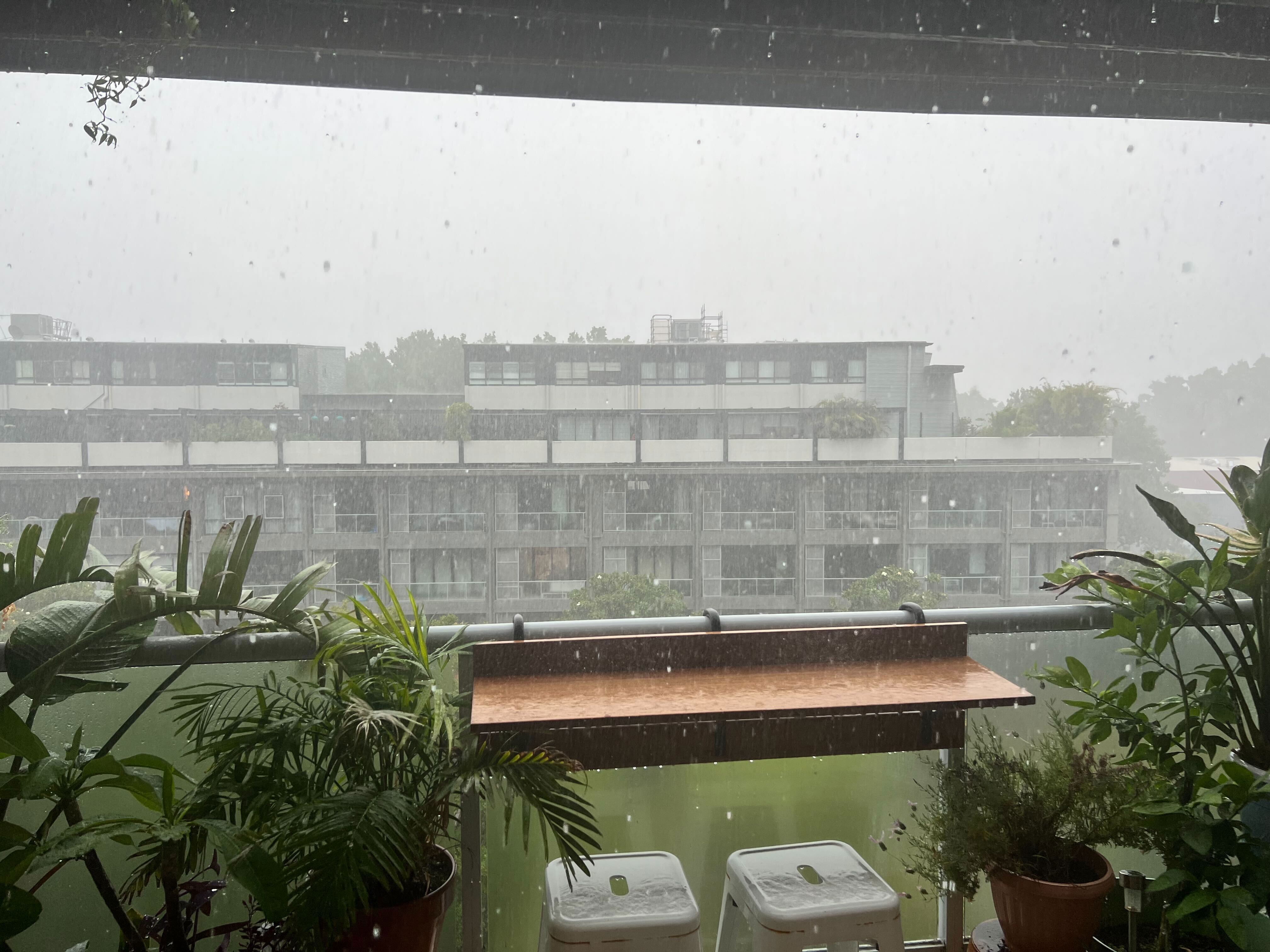 Heavy rain sweeps across Sydney during a freak thunderstorm.