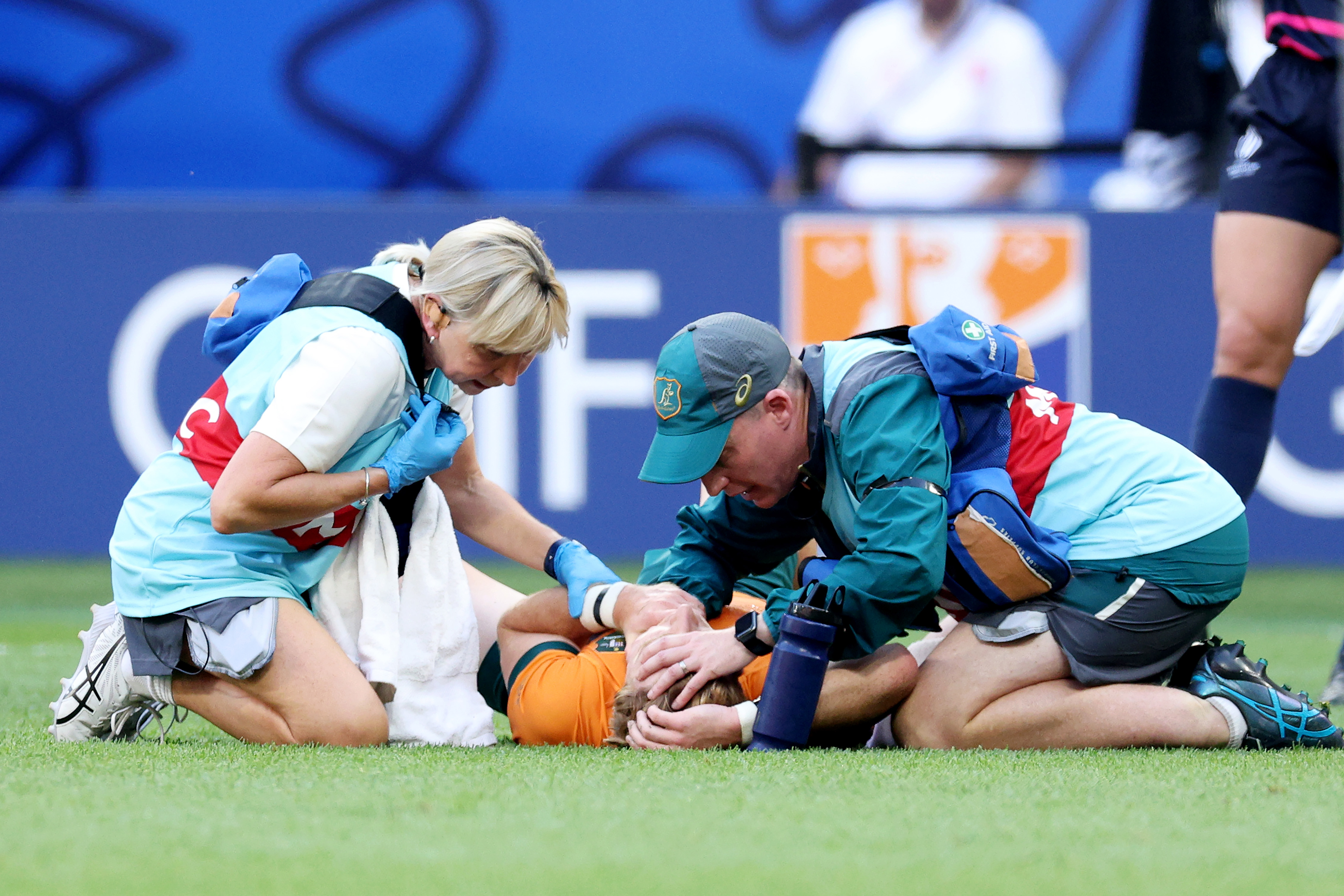 Tate McDermott of Australia receives medical attention.