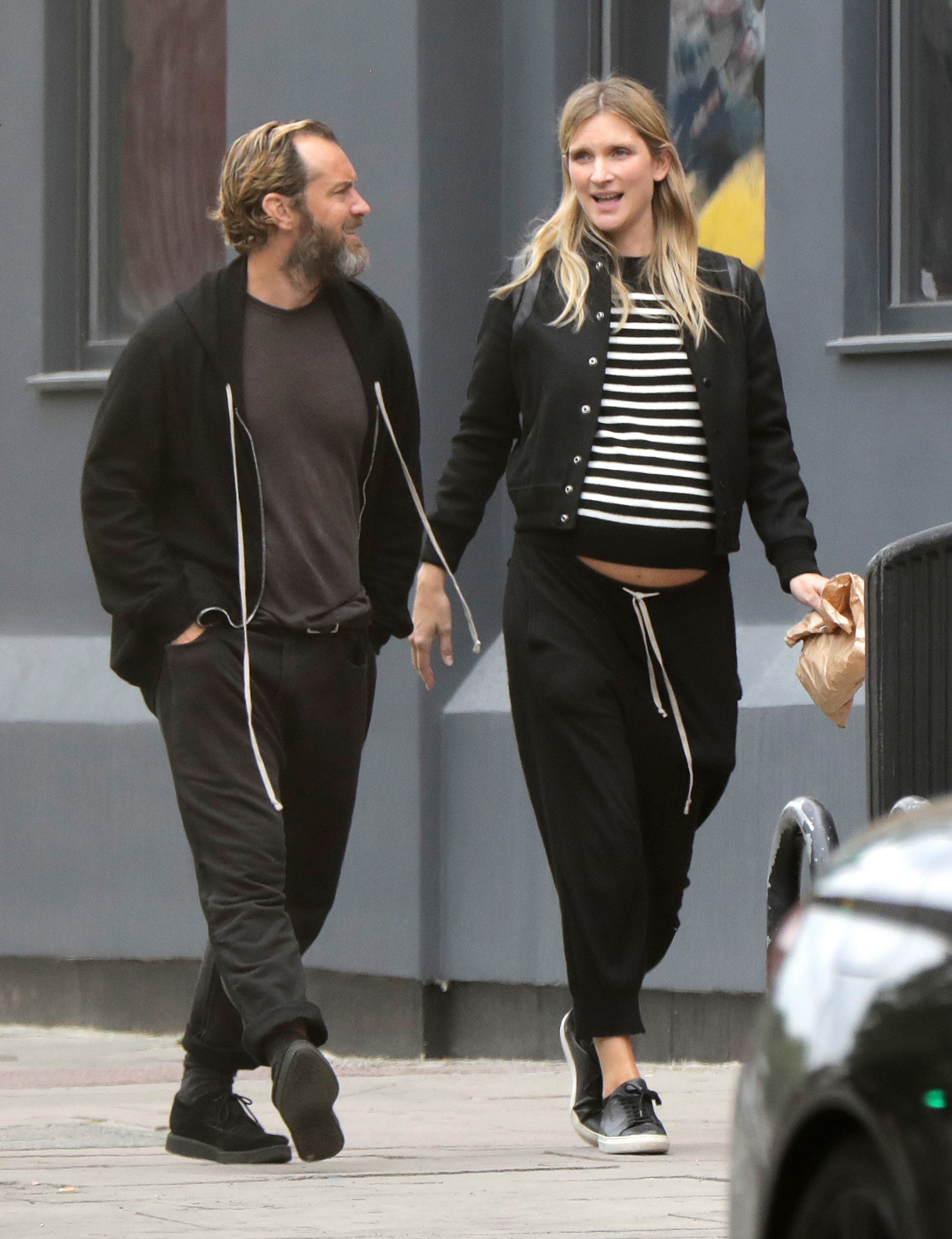 Jude Law and a clearly pregnant wife Phillipa Coan in London in June 2020.