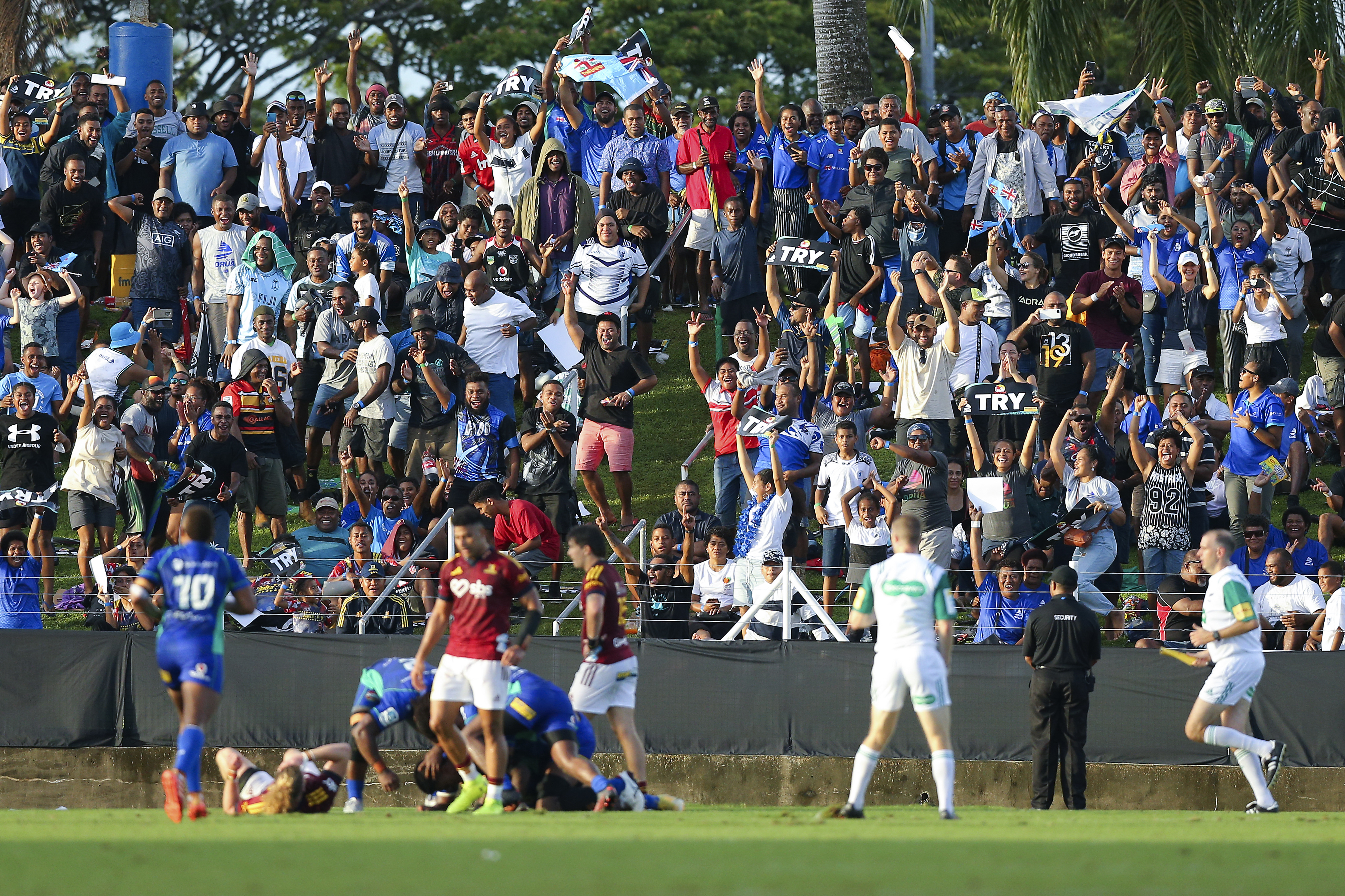 Fans celebrate a Fijian Drua try against the Highlanders in Suva.