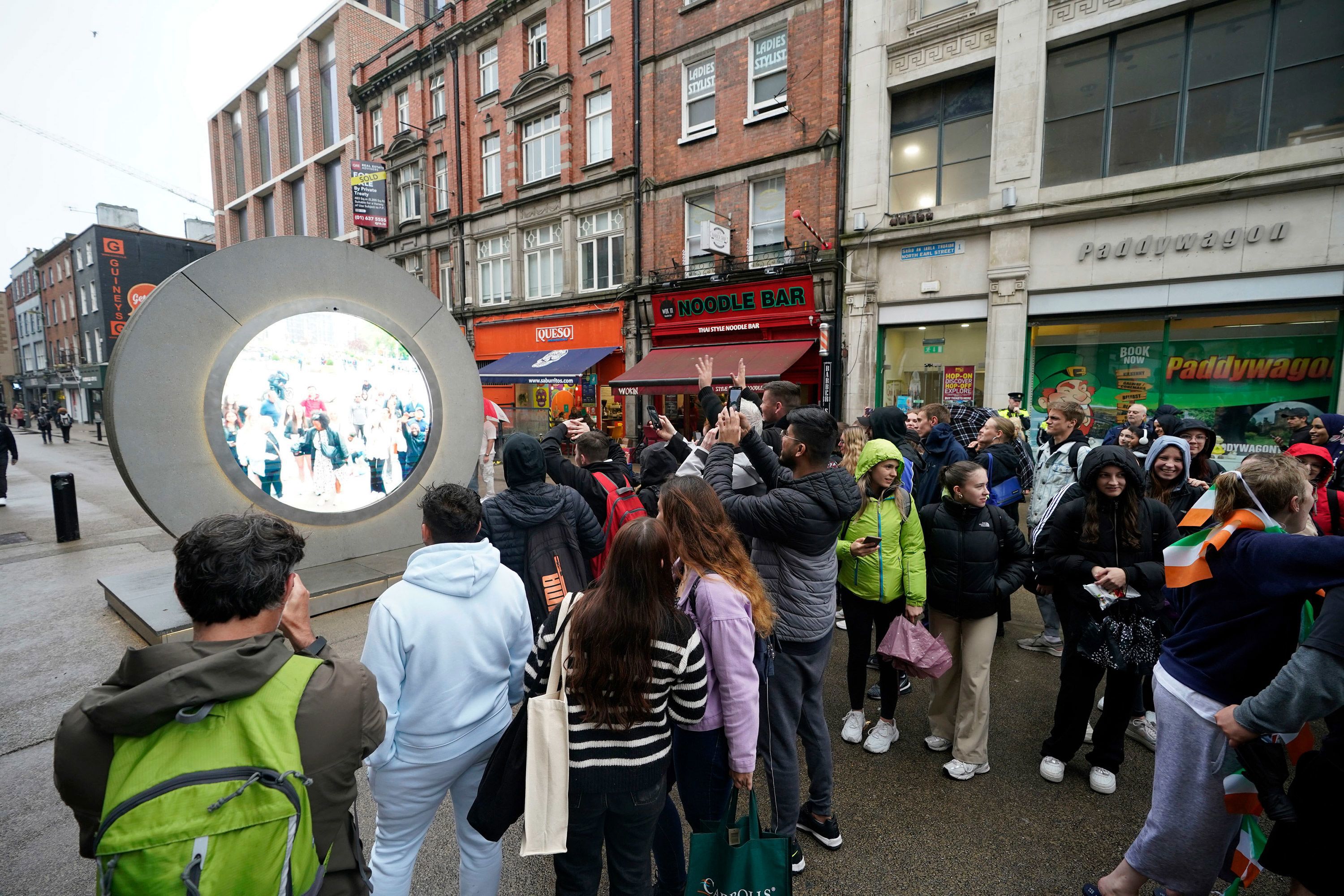 People view the live stream between Dublin and New York, in Dublin, Ireland, on May 13.