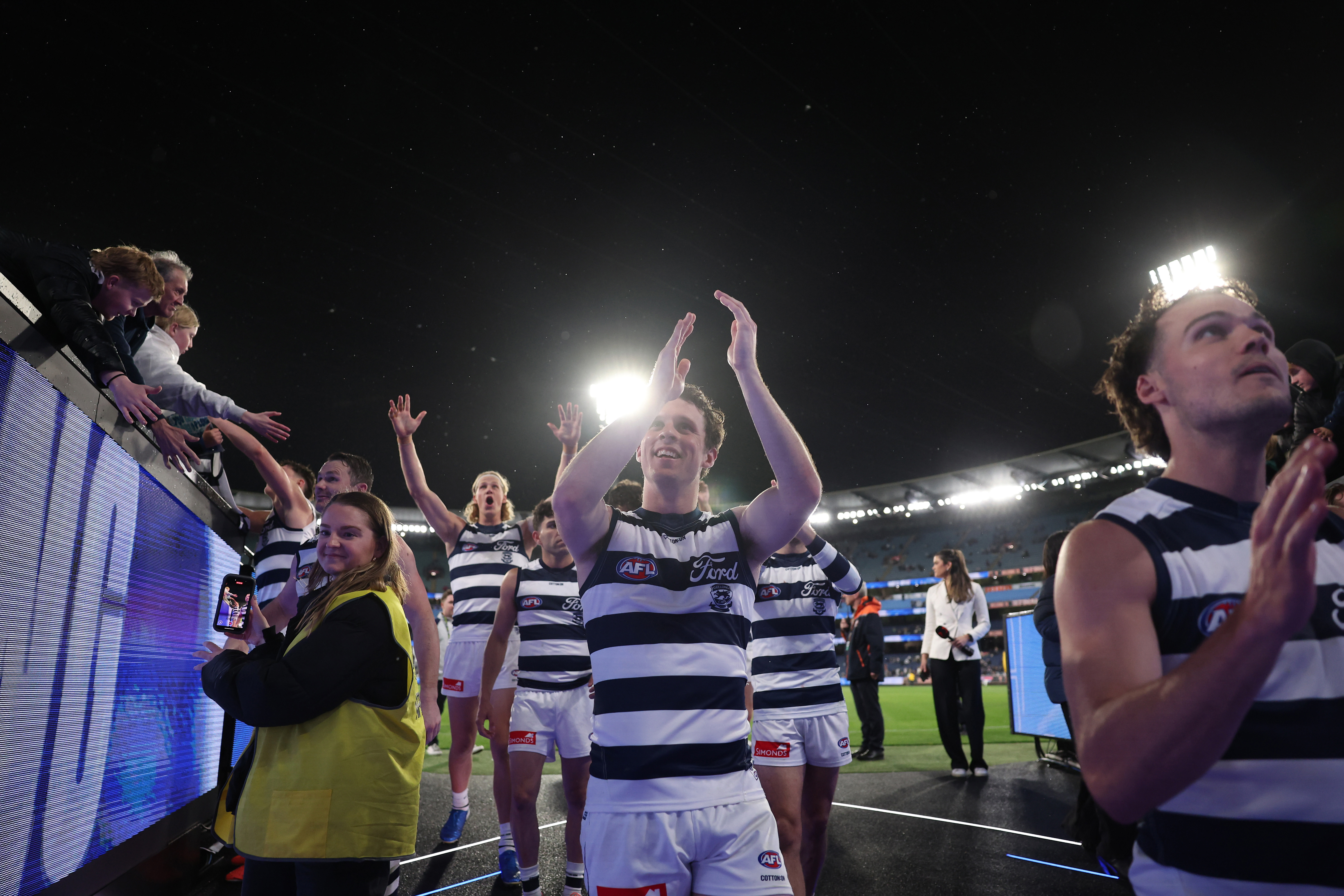 Max Holmes of the Cats acknowledges the fans 