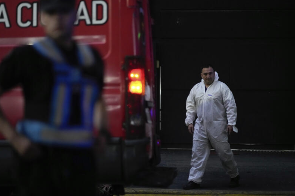 A forensic investigator exits the hotel where English musician Liam Payne, a former member of the band One Direction, was found dead after falling from a balcony in Buenos Aires, Argentina, Wednesday, Oct. 16, 2024.