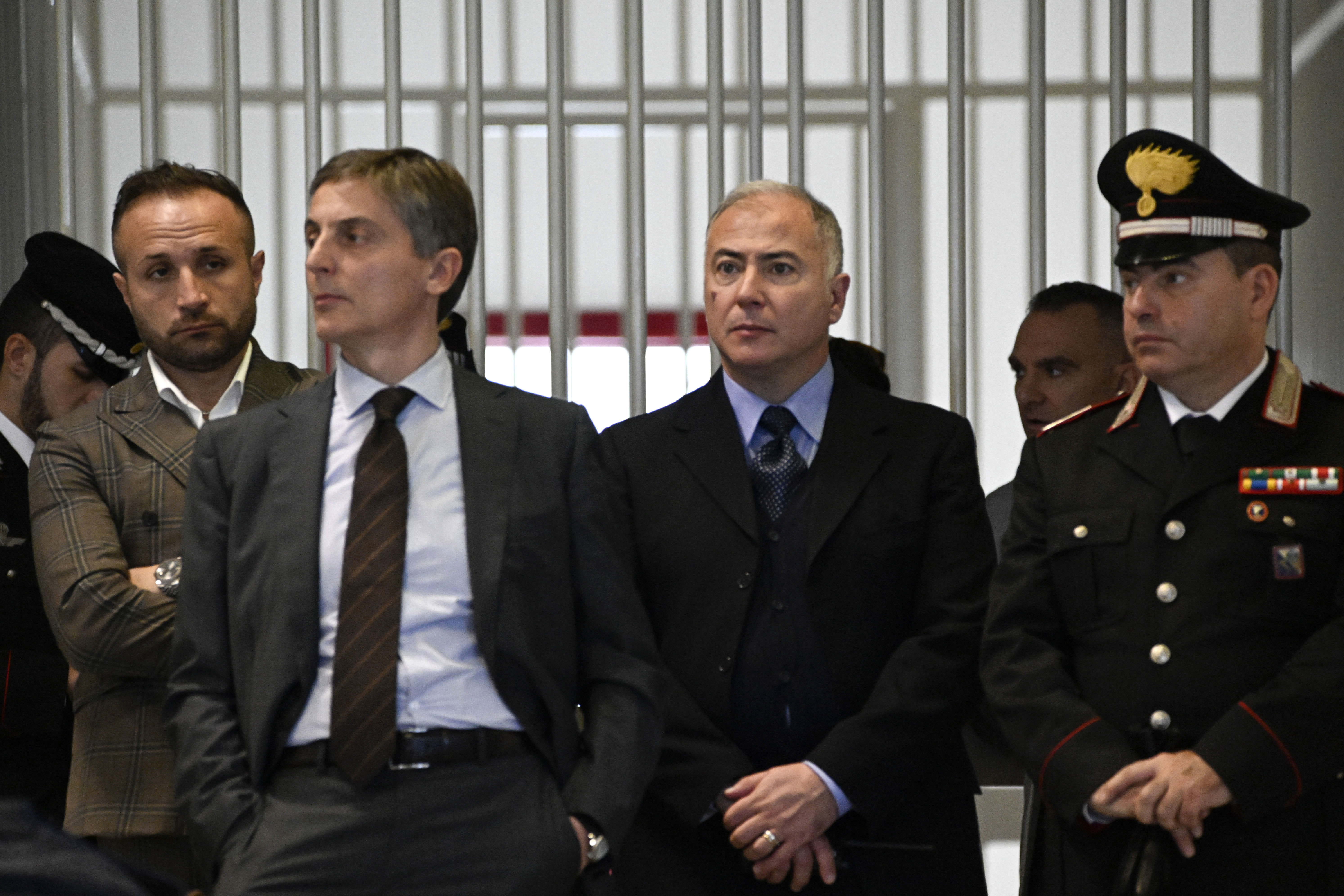 Officials listen as judges read the verdicts of a maxi-trial of hundreds of people accused of membership in Italy's 'ndrangheta organized crime syndicate