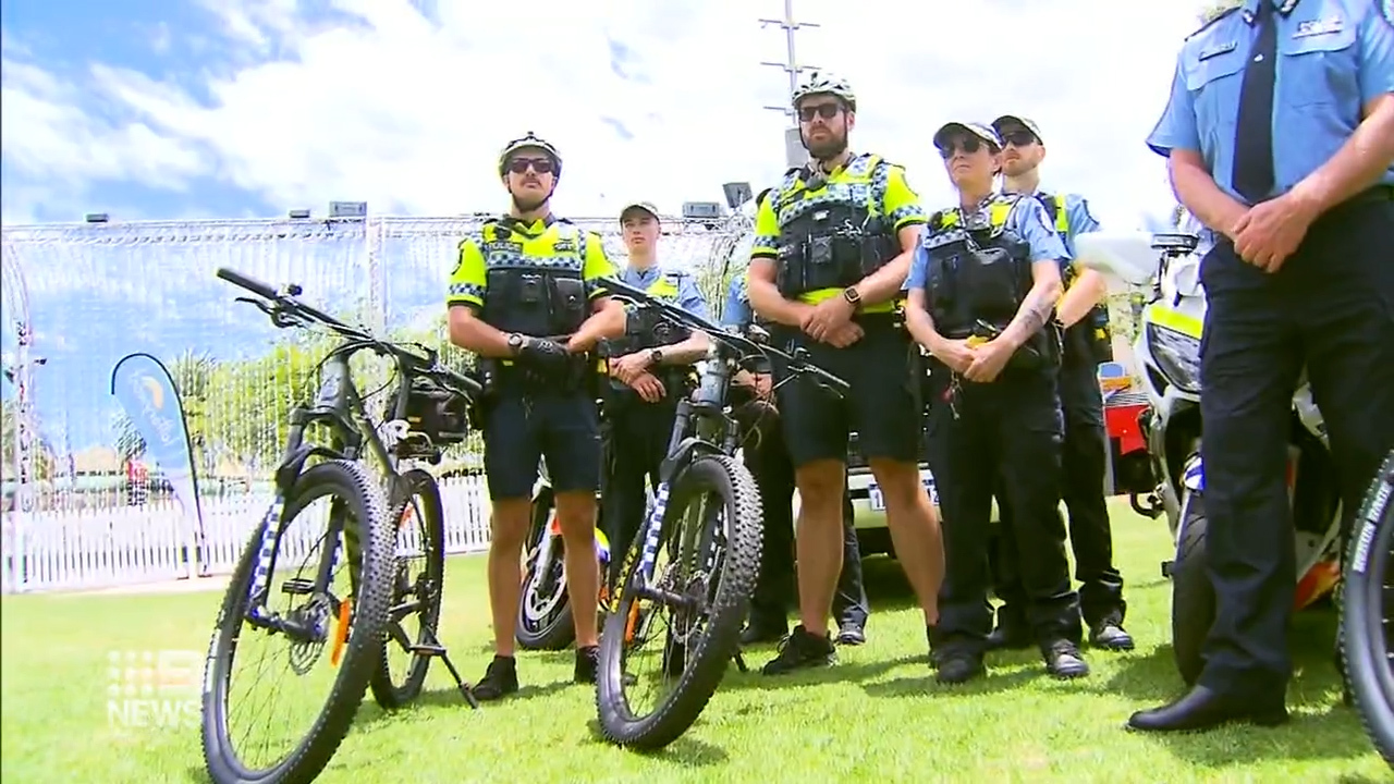 Police officers at a press conference after one of their own was allegedly violently attacked while off duty.