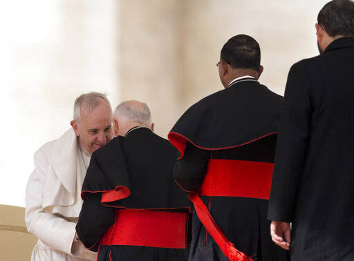 In this Feb. 19, 2014 file photo, Pope Francis greets US cardinal Theodore Edgar McCarrick at the end of his general audience, in St. Peter's Square at the Vatican. 