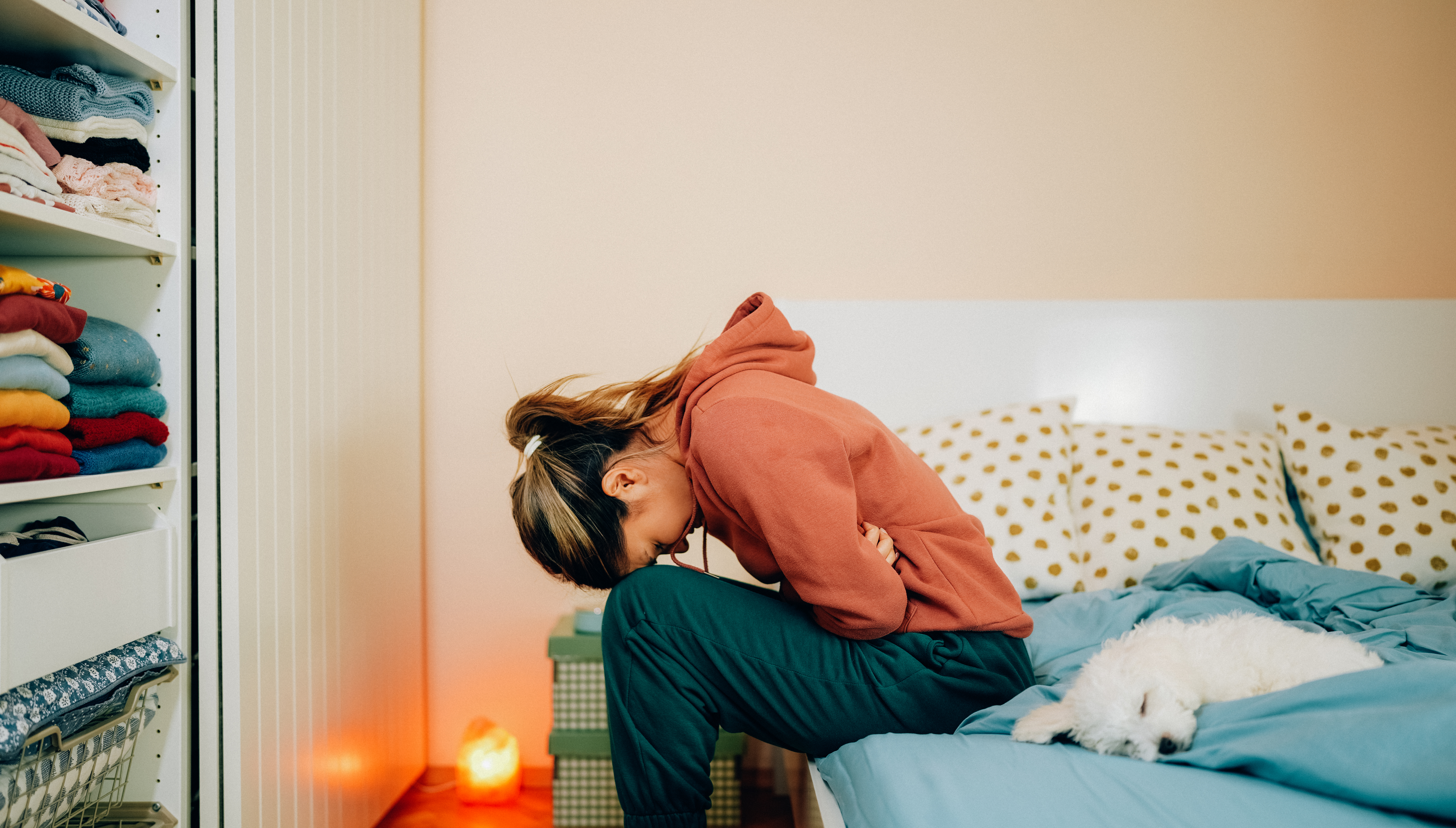 Woman hunched over in pain