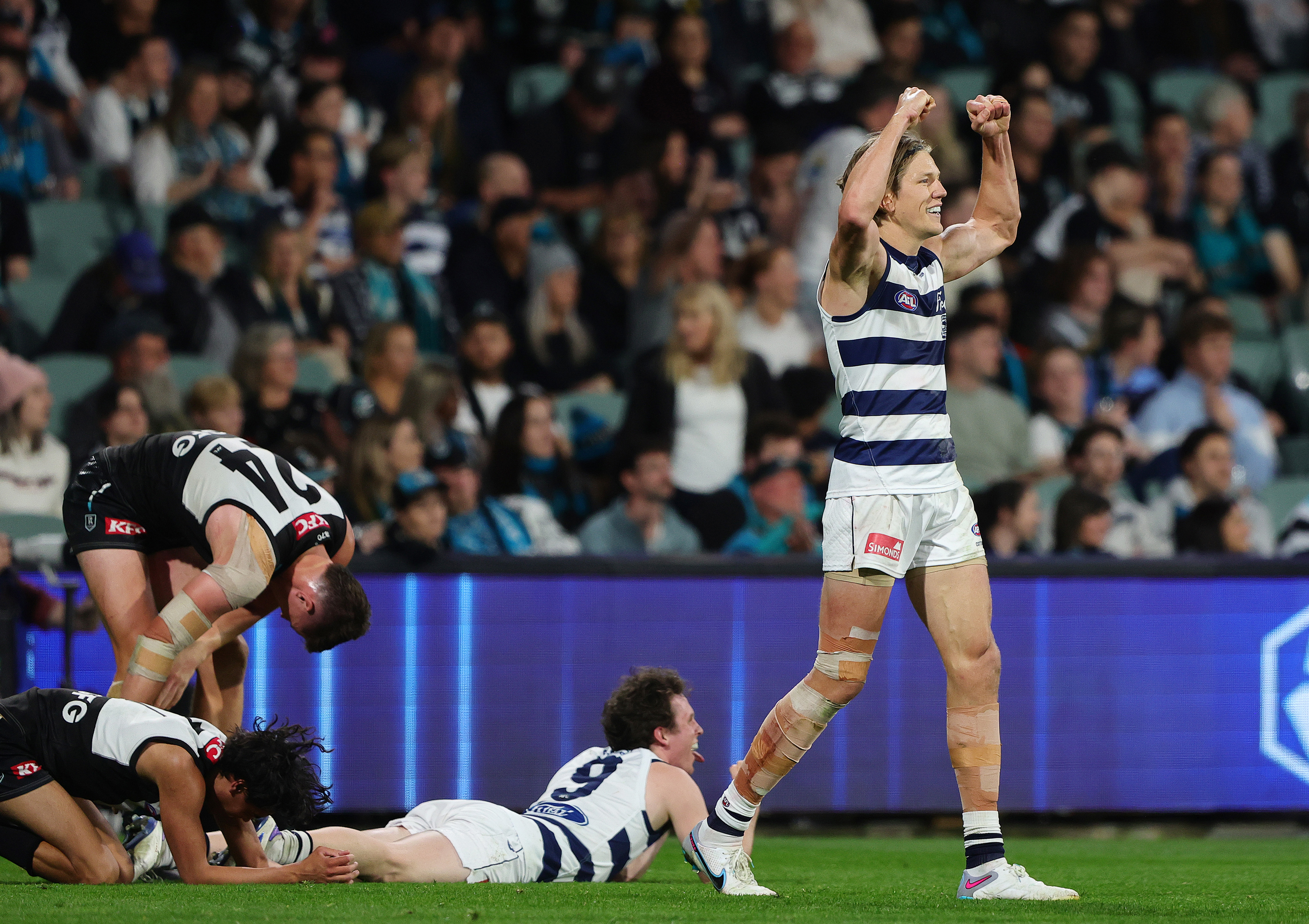 Rhys Stanley of the Cats reacts on the siren.