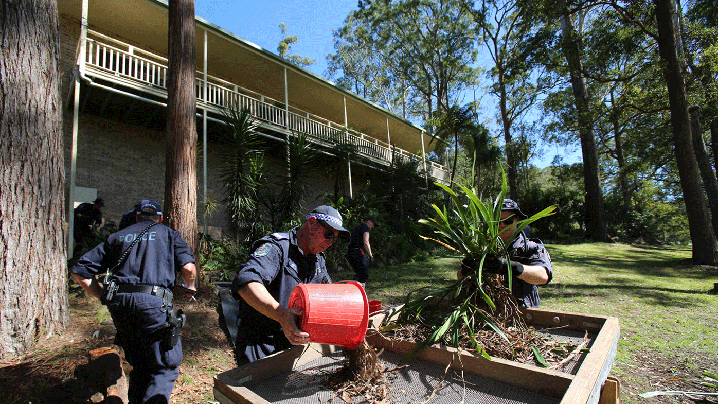 Officers are sifting through the garden by hand at the Kendall property.