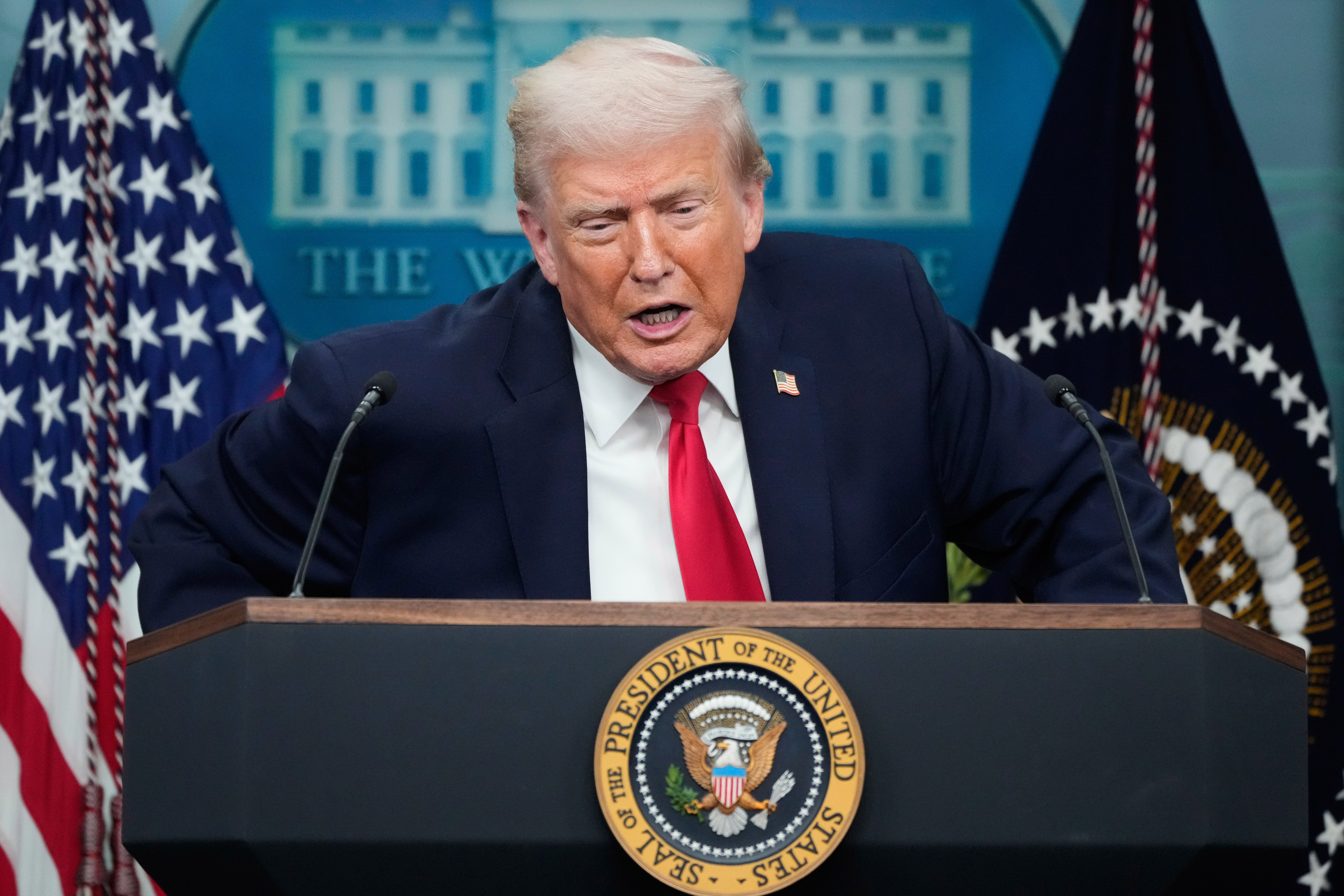 President Donald Trump listens to a question from a reporter during a press briefing at the White House in Washington, Tuesday, Jan. 20, 2026. (AP Photo/Mark Schiefelbein)
