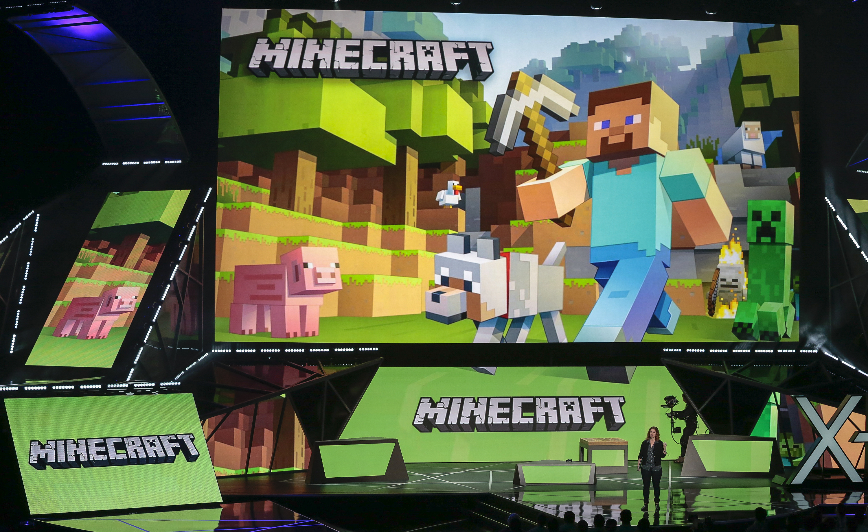 FILE - Lydia Winters shows off Microsoft's "Minecraft" built specifically for HoloLens at the Xbox E3 2015 briefing before Electronic Entertainment Expo, June 15, 2015, in Los Angeles. Security experts around the world raced Friday, Dec. 10, 2021, to patch one of the worst computer vulnerabilities discovered in years, a critical flaw in open-source code widely used across industry and government in cloud services and enterprise software. Cybersecurity experts say users of the online game Minecra