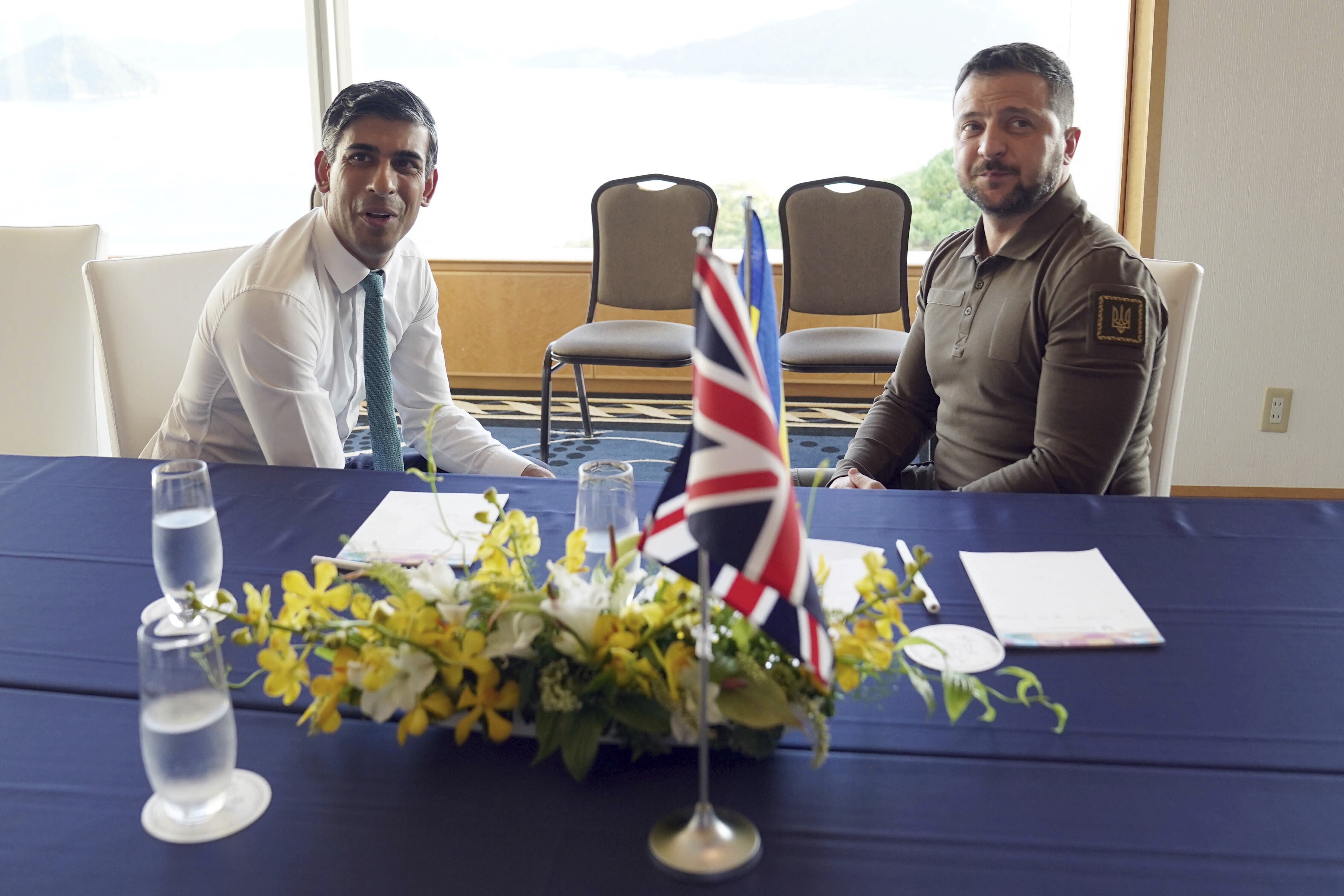 Britain's Prime Minister Rishi Sunak, left, and Ukraine President Volodymyr Zelenskyy meet at the Grand Prince Hotel, during the G7 Summit in Hiroshima, Japan, Saturday, May 20, 2023. 