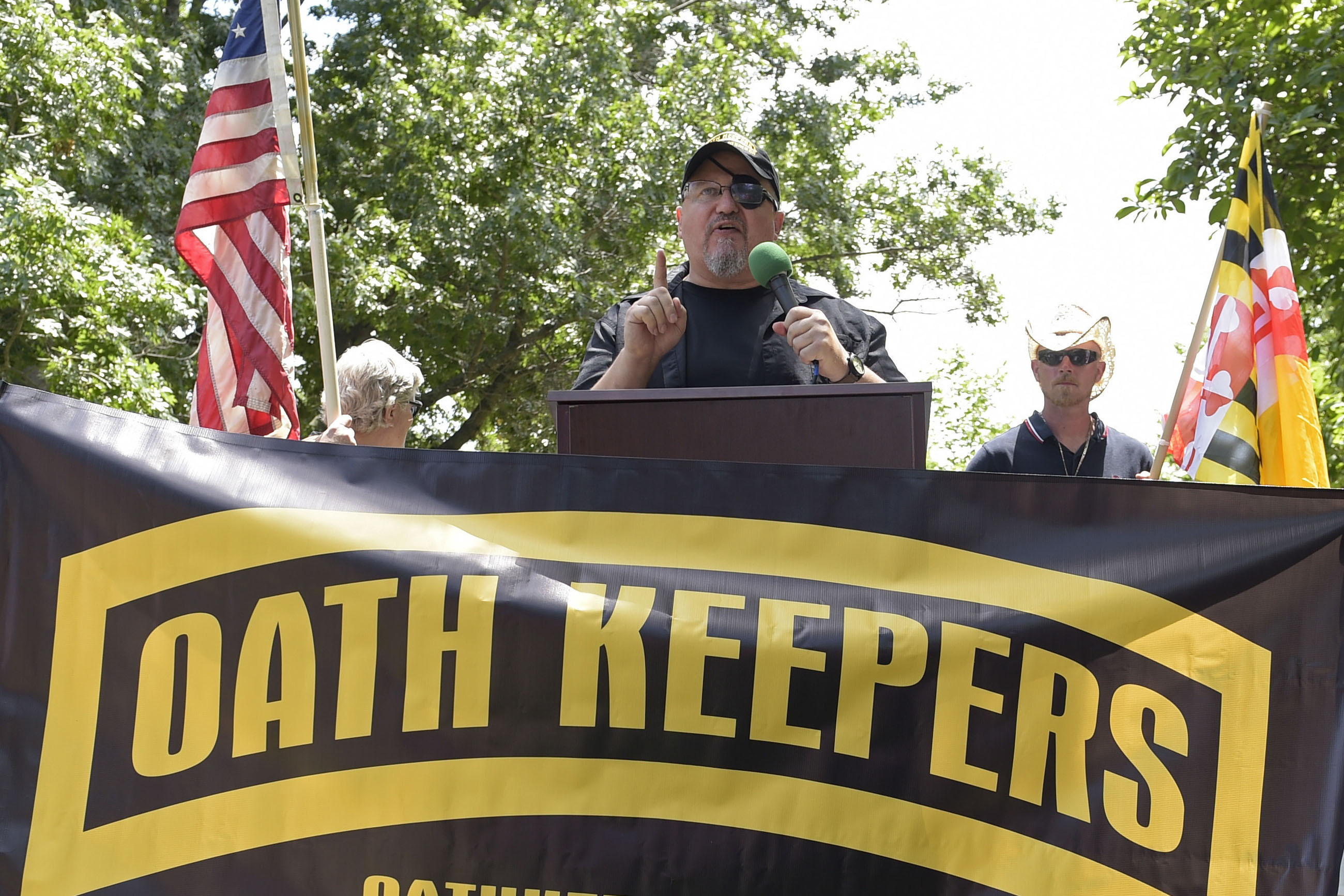 Stewart Rhodes, founder of the Oath Keepers, center, speaks during a rally outside the White House in Washington, June 25, 2017.   