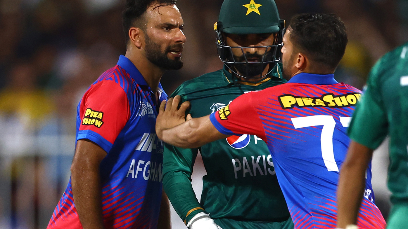 Fareed Ahmad Malik of Afghanistan almost comes to blows with Asif Ali of Pakistan during the Asian Cup match in Sharjah.