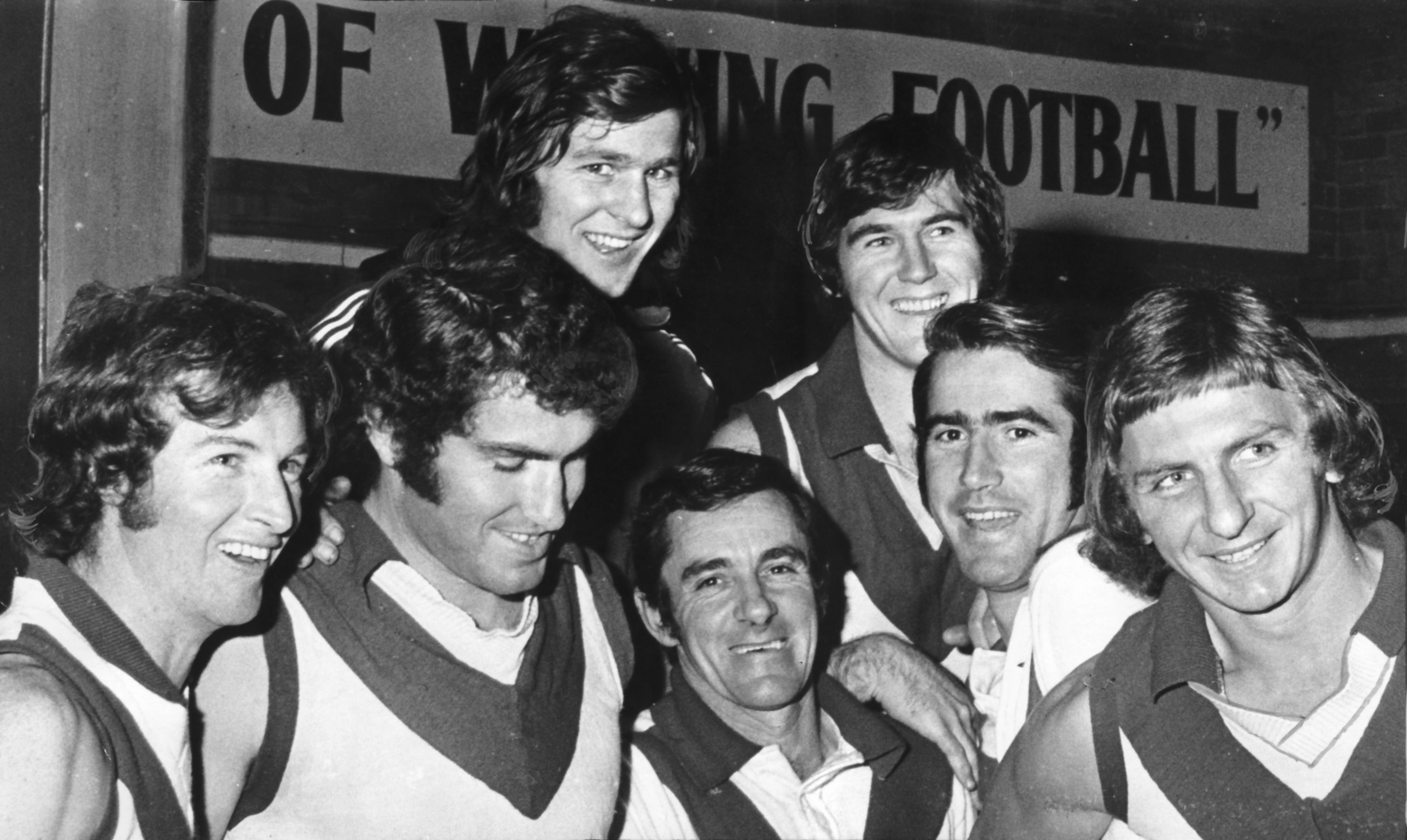 South Melbourne Football Club (Later Sydney Swans) - VFL - Victorian Football League (Later AFL). Right: Congratulating Graeme John (second from right) on his reappointment are from left: Peter Bedford, Ricky Quade, Norm Goss, Reserves coach Ken McCormack, David McLeish and Jim Prentice. File