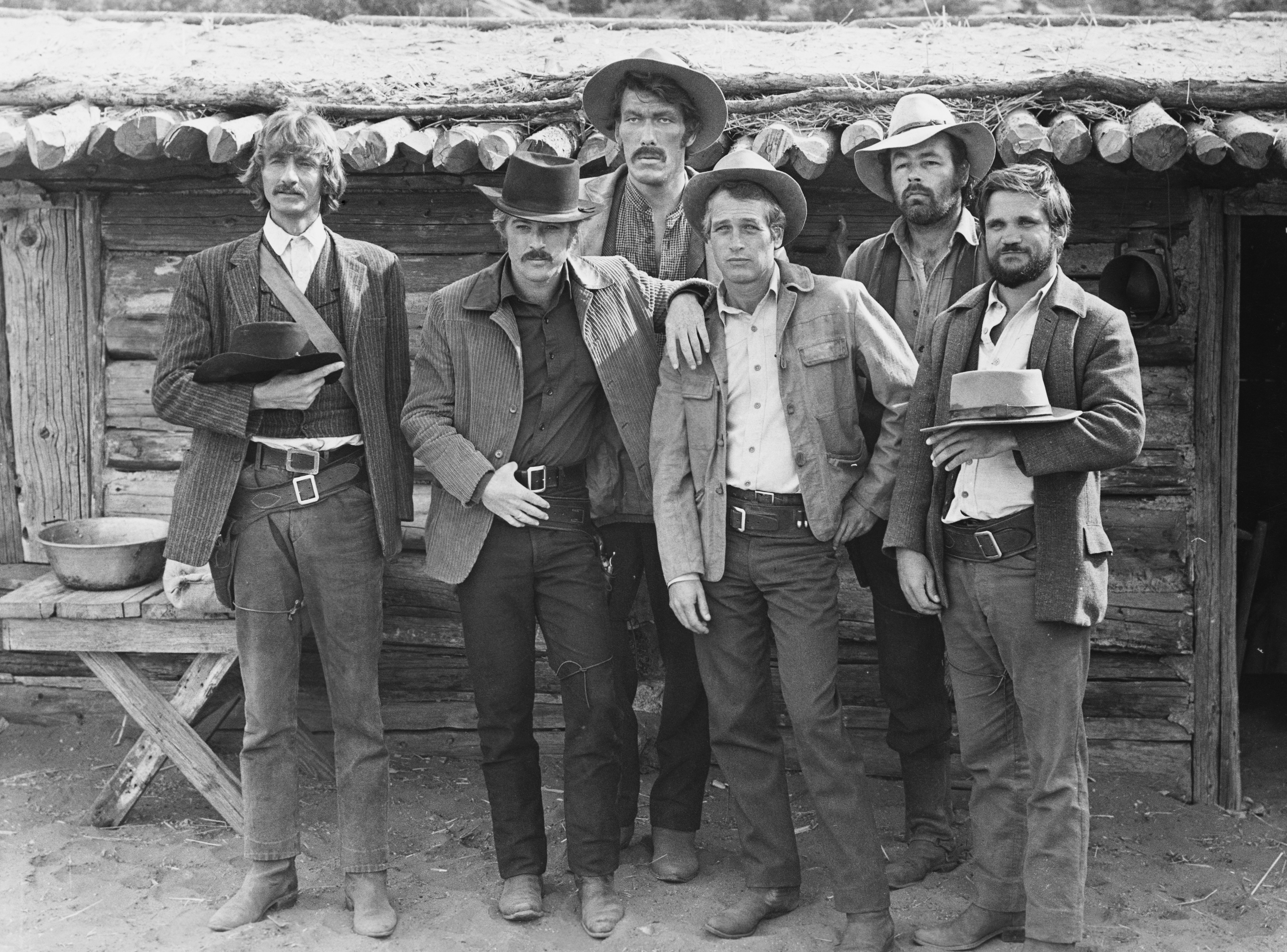The cast of Butch Cassidy and the Sundance Kid (1969) from left to right: Timothy Scott as News Carver, Robert Redford as Sundance Kid, Ted Cassidy as Harvey Logan, Paul Newman as Butch Cassidy, Dave Dunlap, and Charles Dierkop as Flat Nose Curry.