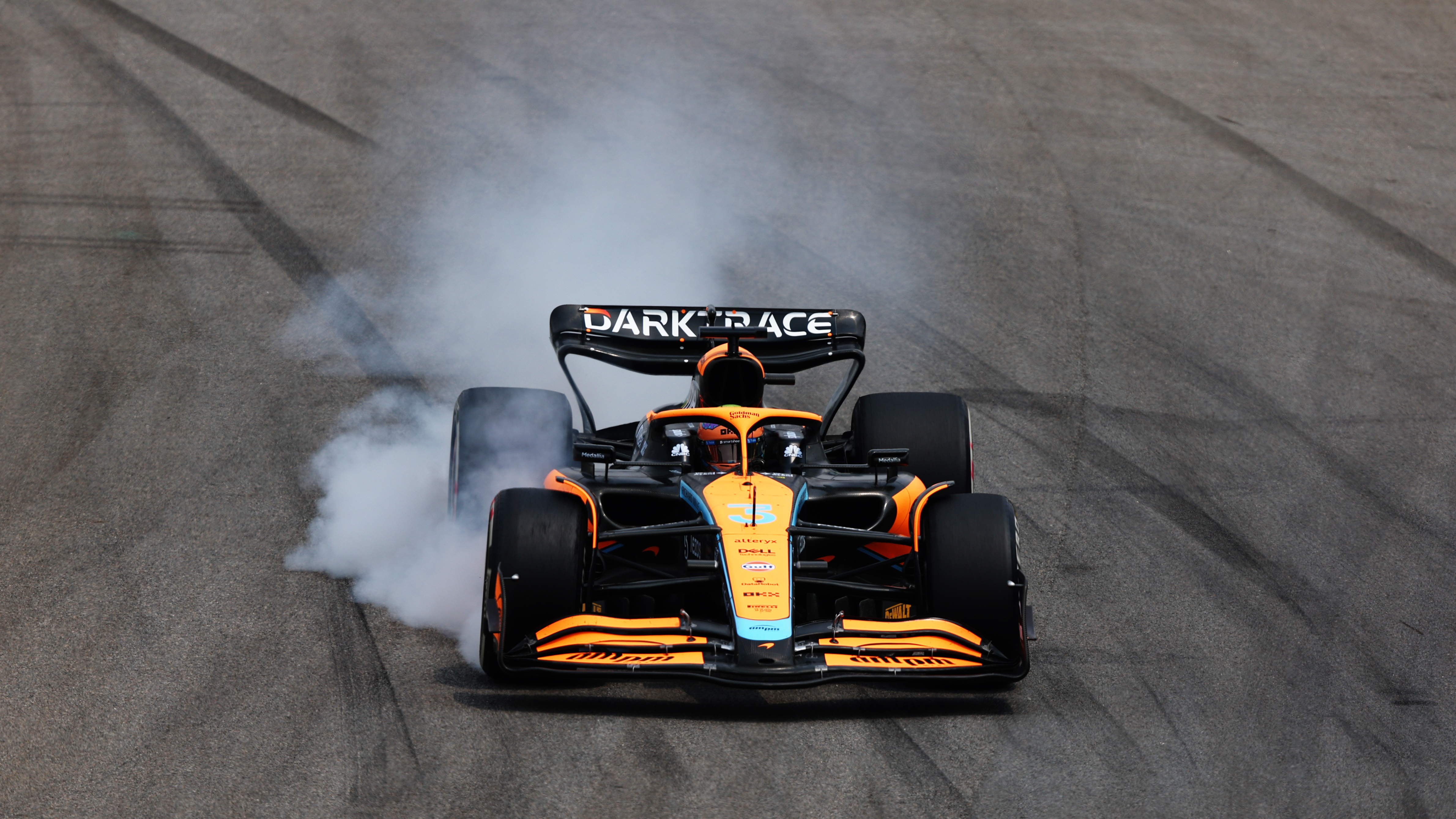 Daniel Ricciardo locks up the right front wheel of his McLaren at the Brazilian Grand Prix.