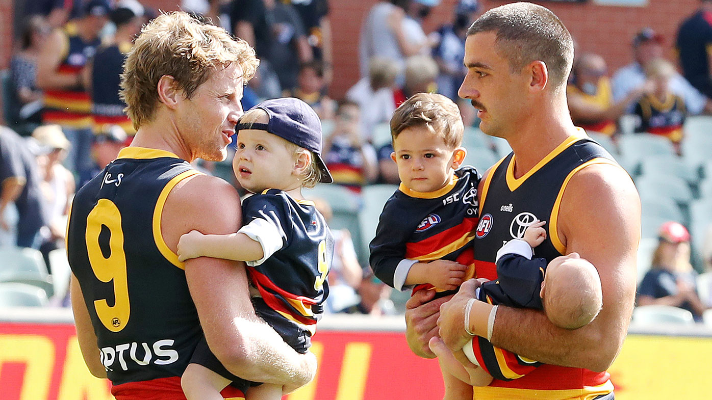 ADELAIDE, AUSTRALIA - MARCH 20: Rory Sloane of the Crows and team mate Taylor Walker with their children before the 2021 AFL Round 01 match between the Adelaide Crows and the Geelong Cats at Adelaide Oval on March 20, 2021 in Adelaide, Australia. (Photo by Sarah Reed/AFL Photos via Getty Images)