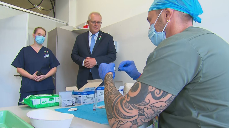 Scott Morrison meets medics as he visited the new Sydney vaccine centre.