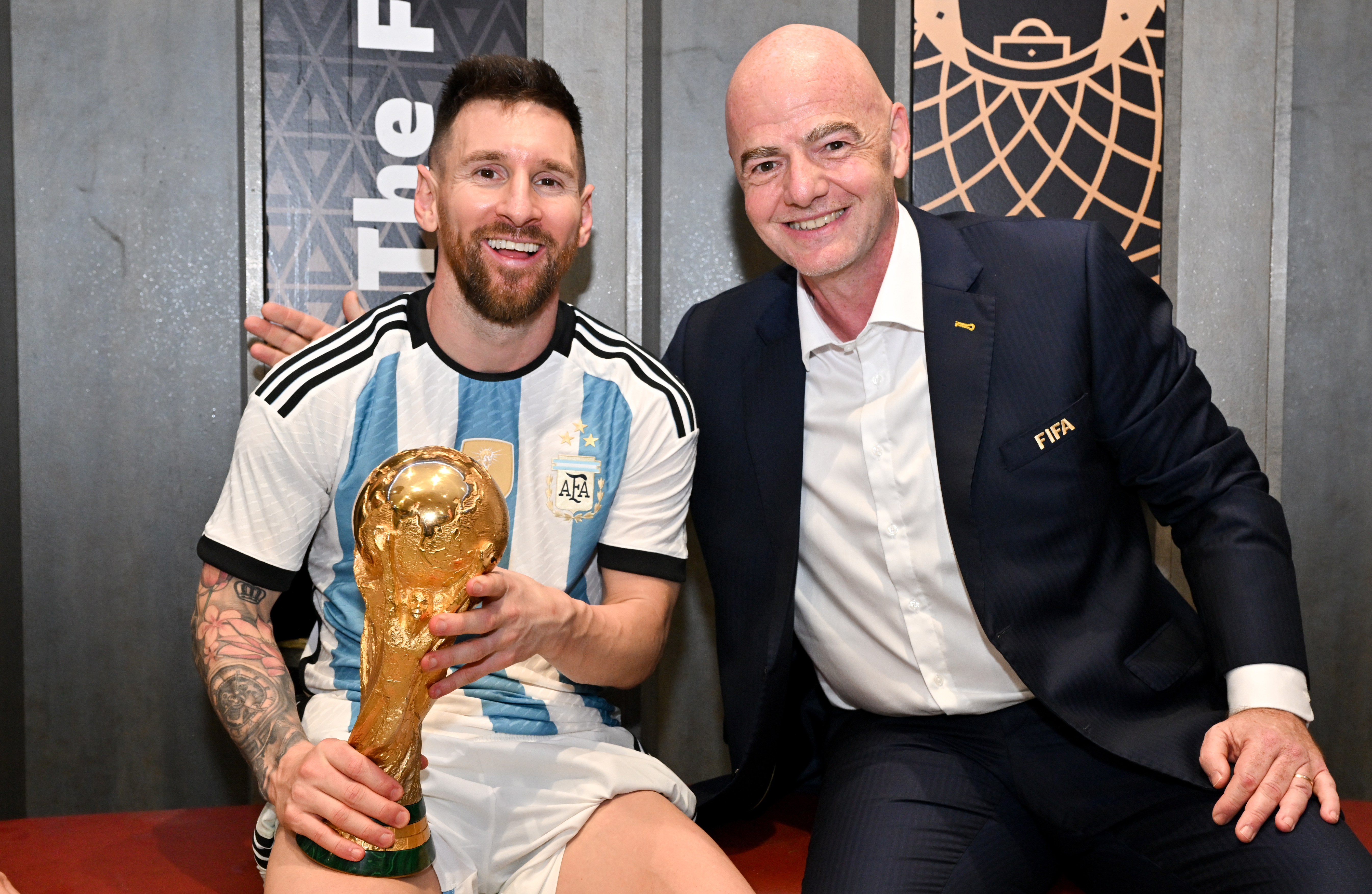 FIFA President Gianni Infantino poses with Lionel Messi in the Argentina dressing room.