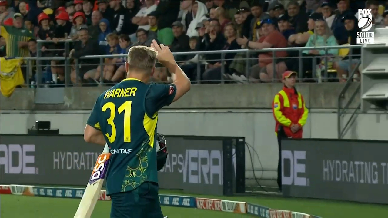 David Warner gestures to the Wellington crowd as he is booed off the field.