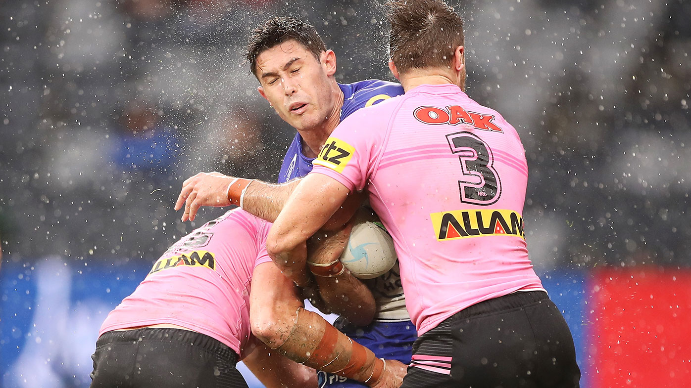 Penrith's defence takes care of Nick Meaney of the Bulldogs at Bankwest Stadium.