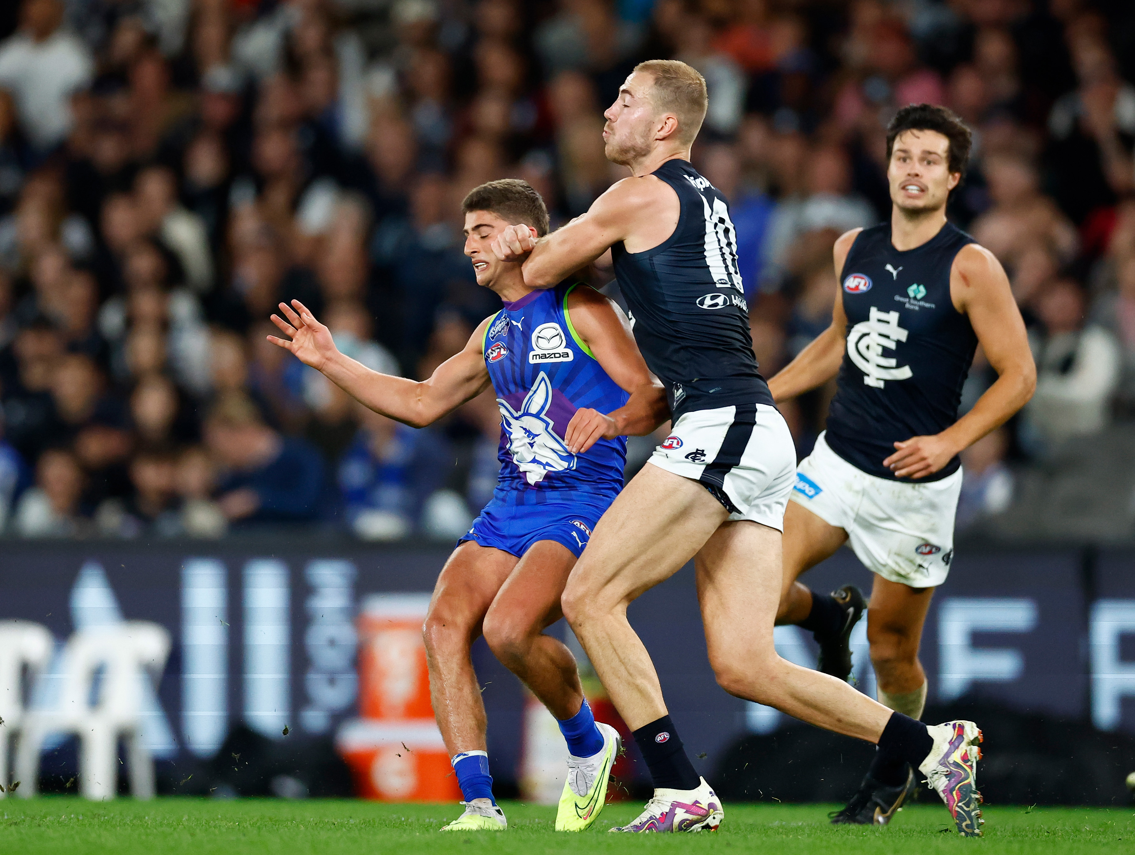 MELBOURNE - APRIL 07: Harry Sheezel of the Kangaroos is taken high by Harry McKay of the Blues during the 2023 AFL Round 04 match between the North Melbourne Kangaroos and the Carlton Blues at Marvel Stadium on April 7, 2023 in Melbourne, Australia. (Photo by Michael Willson/AFL Photos)