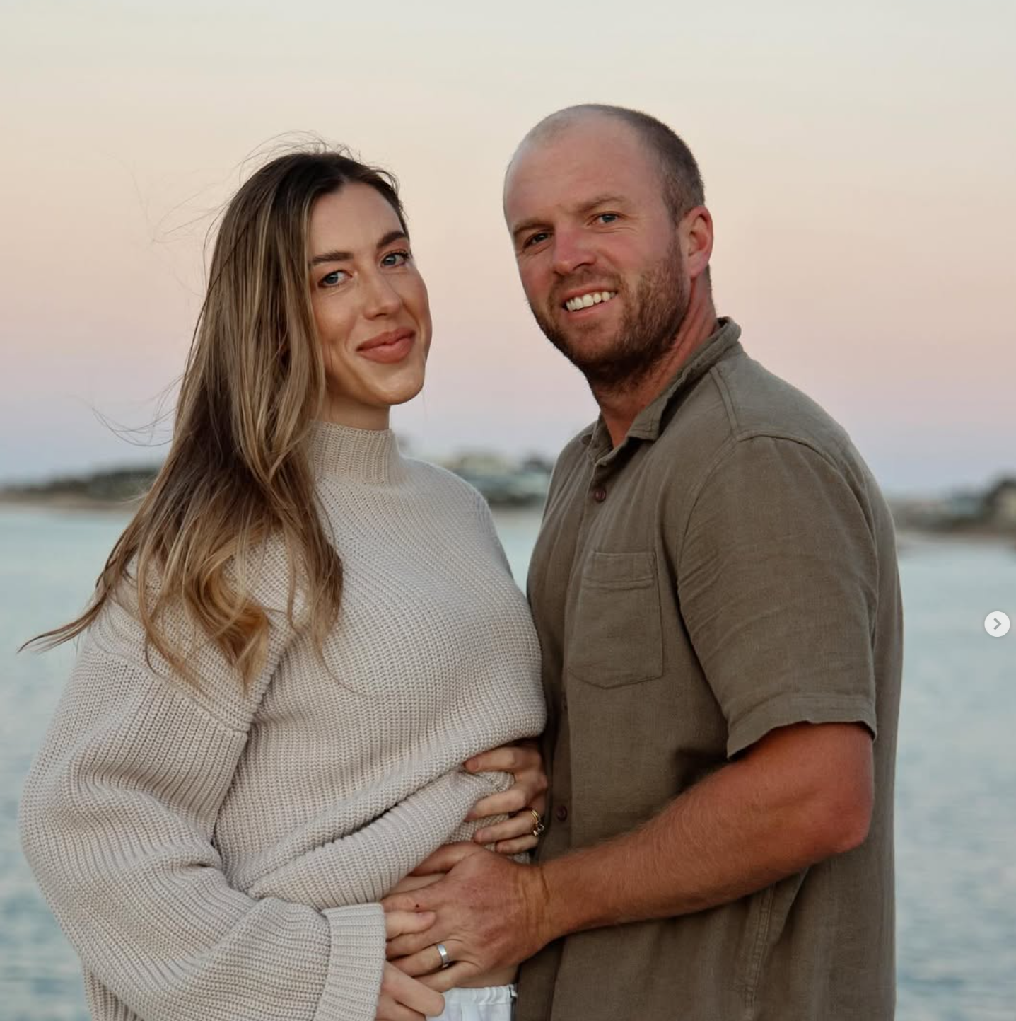 Jaryd Dawson (right) pictured with then pregnant wife Jessica Carter Dawson.