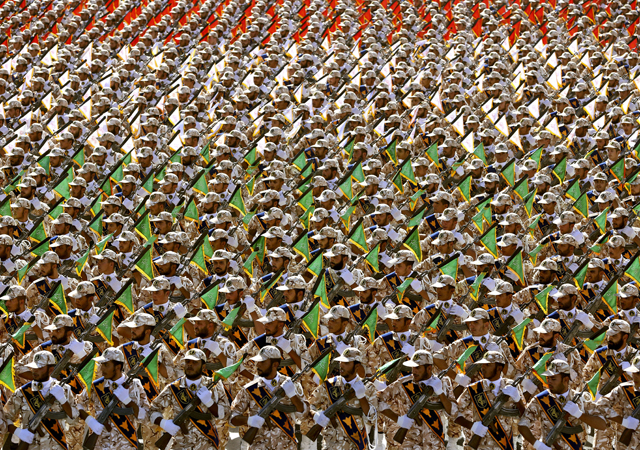 Members of the Iran's Revolutionary Guard march during an annual military parade at the mausoleum of Ayatollah Khomeini, outside Tehran, Iran.