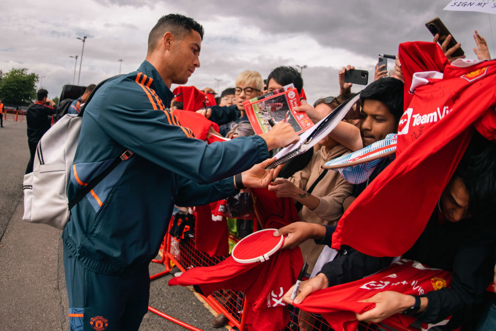 Cristiano Ronaldo signing autographs.