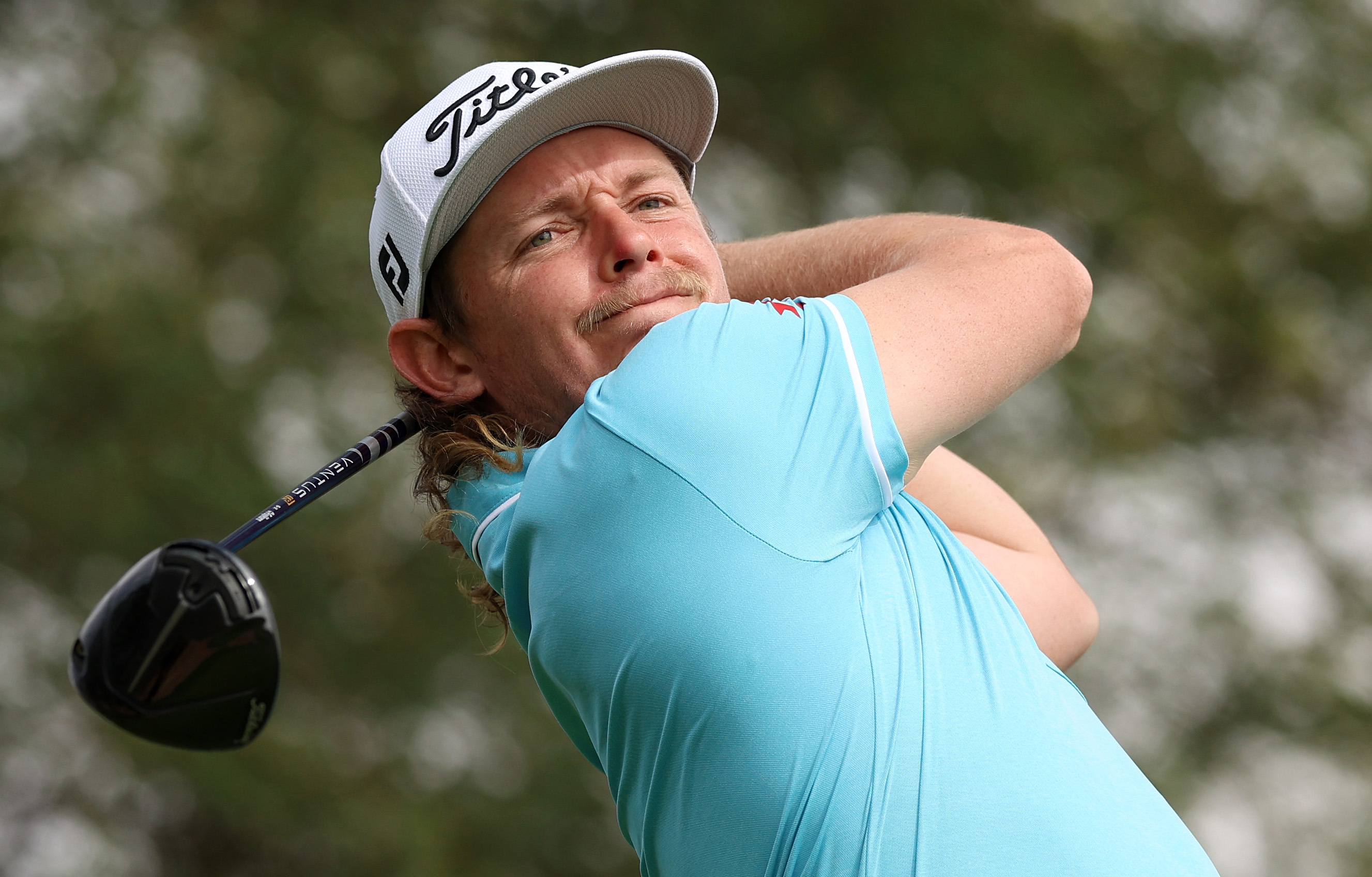 Cameron Smith of Australia plays a tee shot during a practice round prior to the PIF Saudi International at Royal Greens Golf & Country Club on February 01, 2023 in Al Murooj, Saudi Arabia. (Photo by Luke Walker/WME IMG/WME IMG via Getty Images)