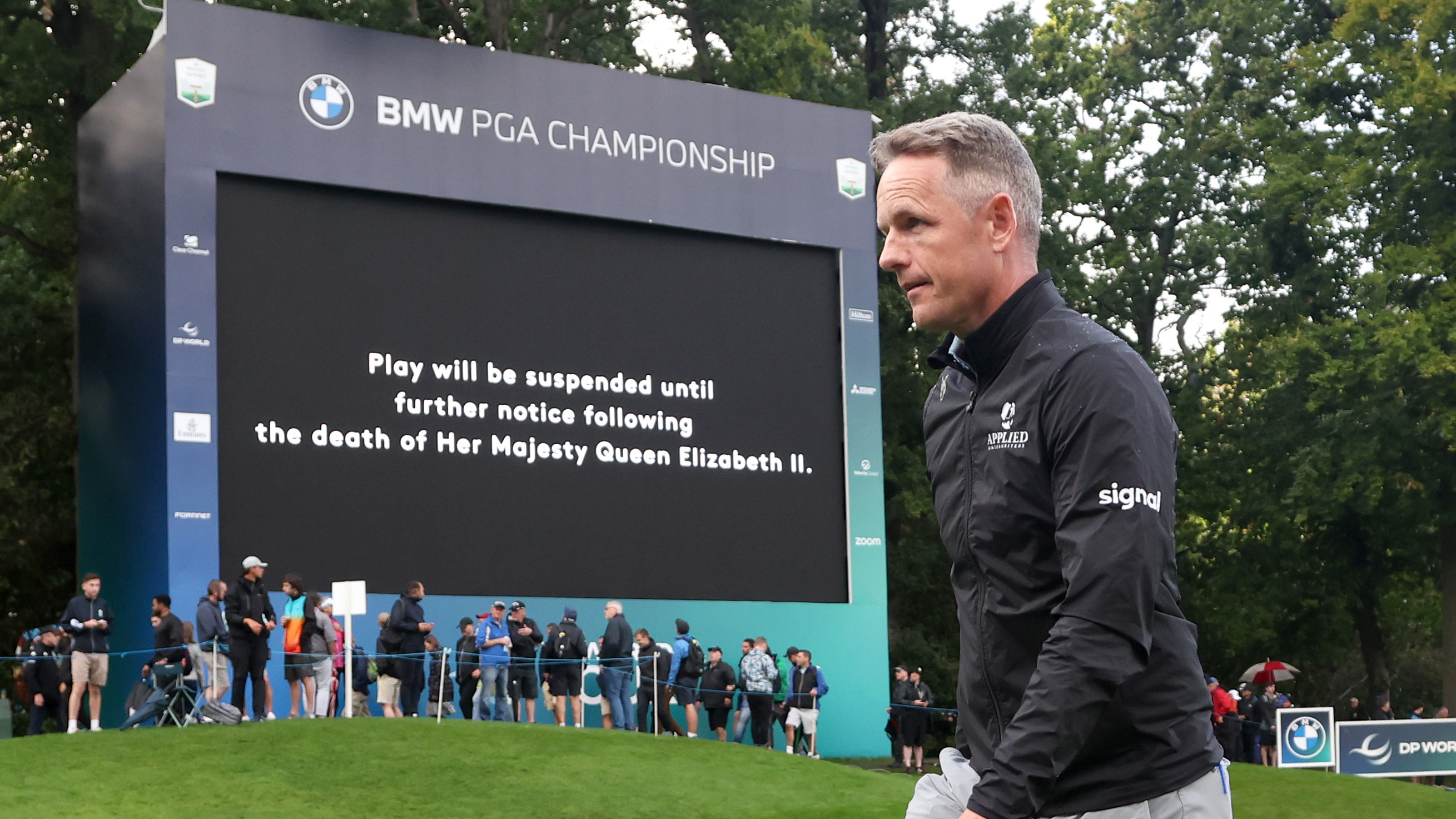 Luke Donald of England leaves the 18th green as play is suspended following the announcement of the death of Her Majesty Queen Elizabeth II during Day One of the BMW PGA Championship at Wentworth Golf Club on September 08, 2022 in Virginia Water, England. (Photo by Warren Little/Getty Images)