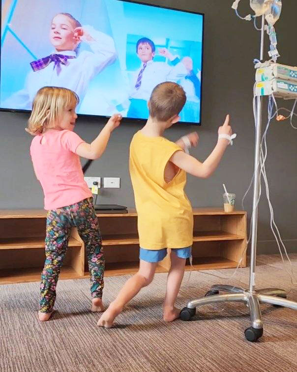 Oliver remained in "high spirits" his mother said. He is pictured here dancing with his sister in hospital. 