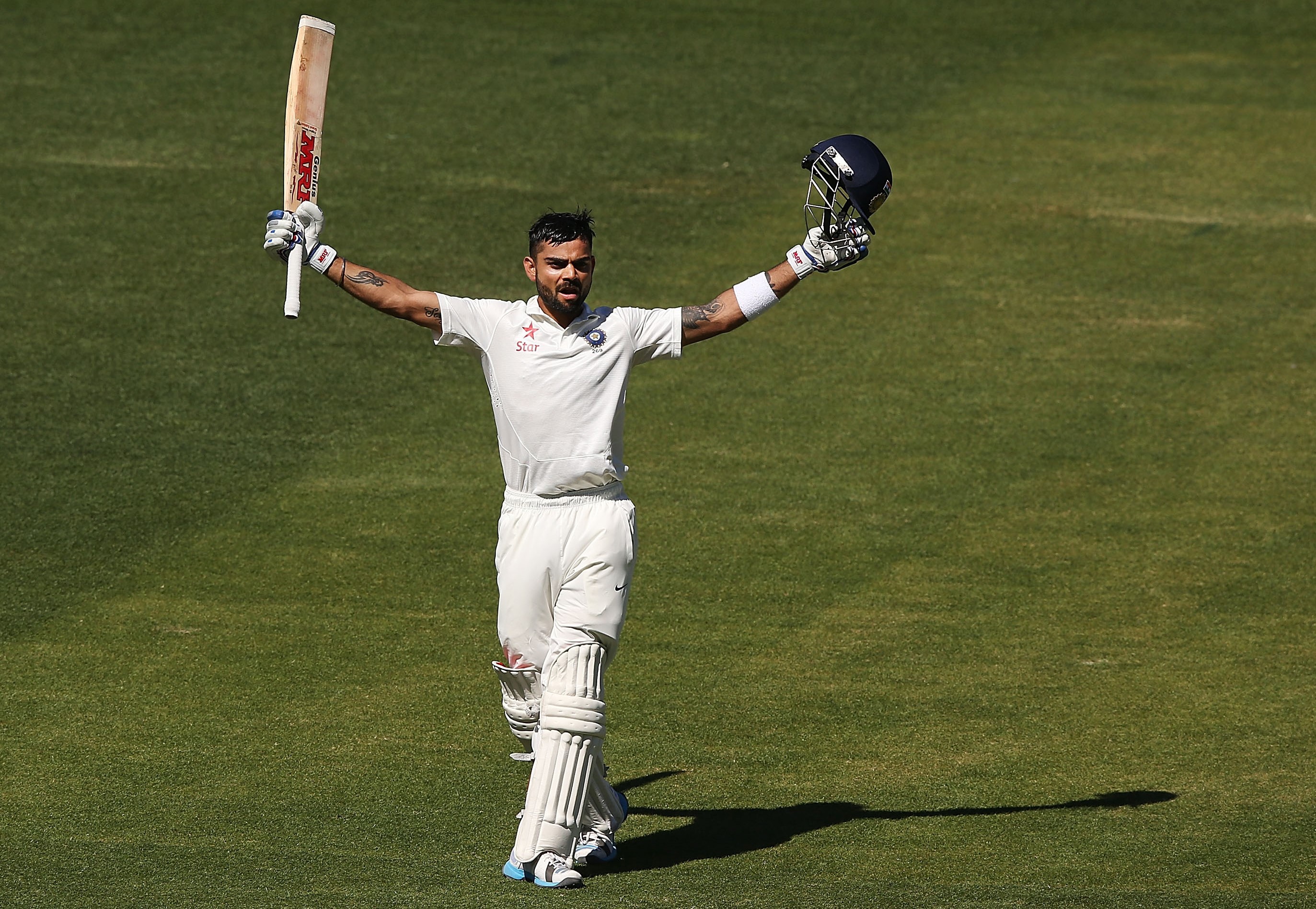 Virat Kohli celebrates scoring his second of two centuries during the 2014 Adelaide Test.