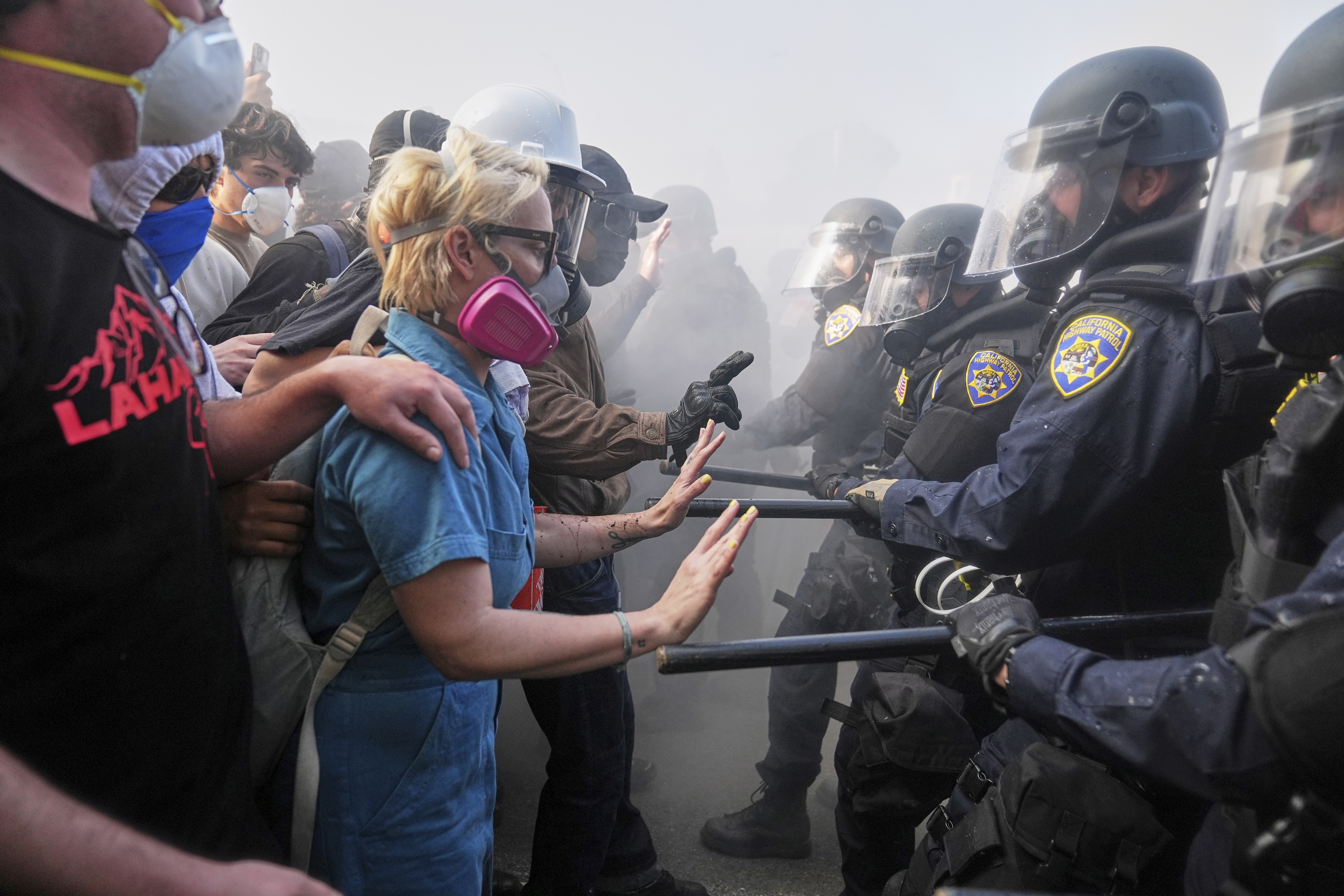 Protesters confront police on the 101 Freeway near the metropolitan detention centre of downtown Los Angeles.