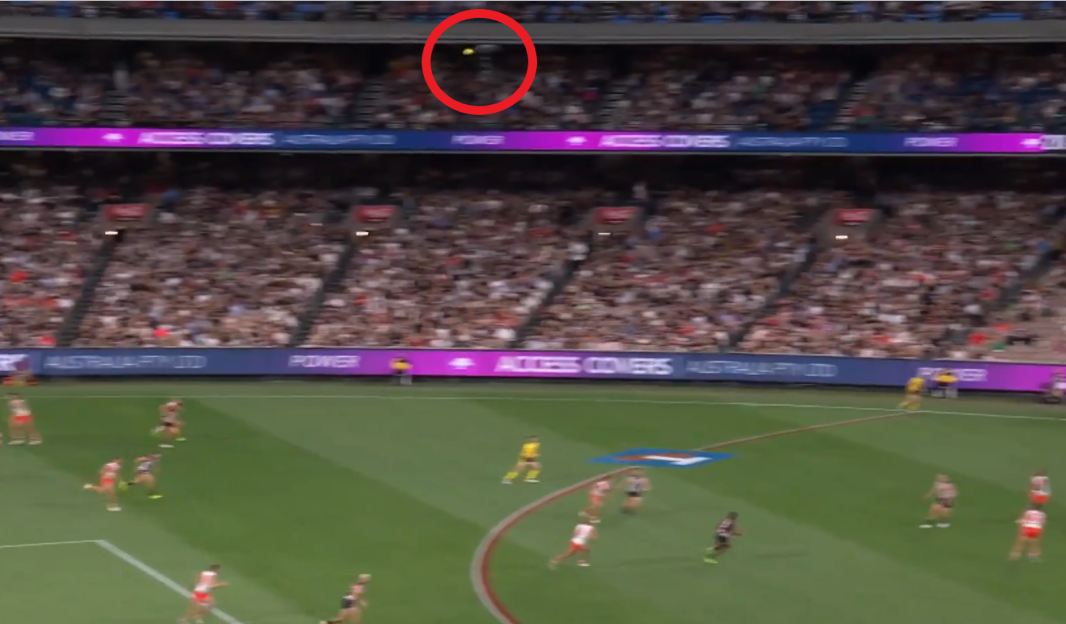 The ball was kicked so high that it hit the camera.