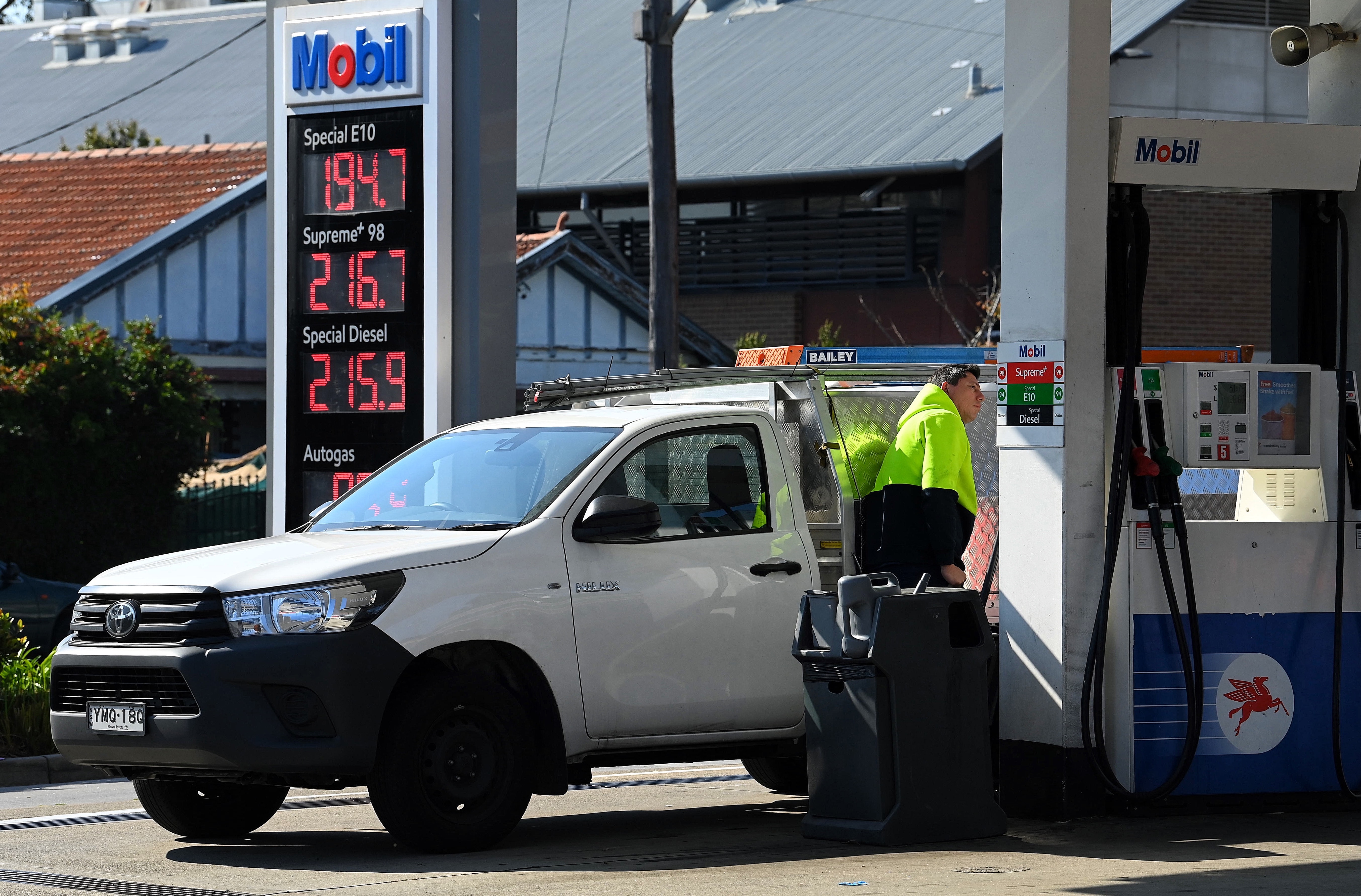 Customers fill their vehicles at the 7 Eleven Mobil petrol station on Liverpool Road in Ashfield, NSW.